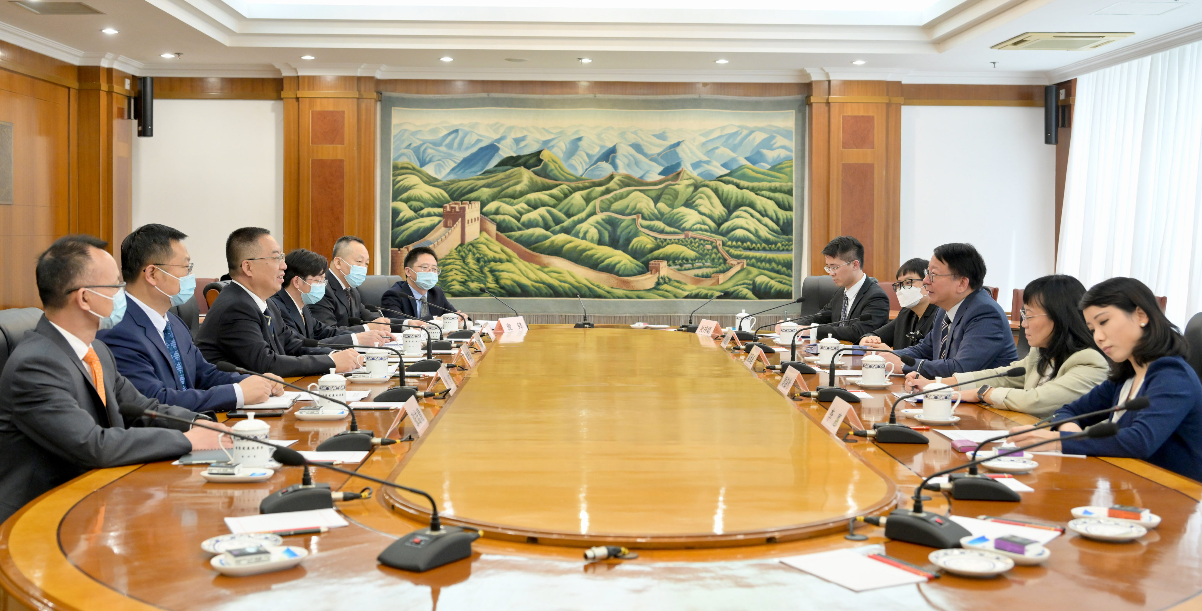 Chief Secretary Eric Chan (third right) at a meeting in Beijing as part of a working trip to the capital. Photo: Handout