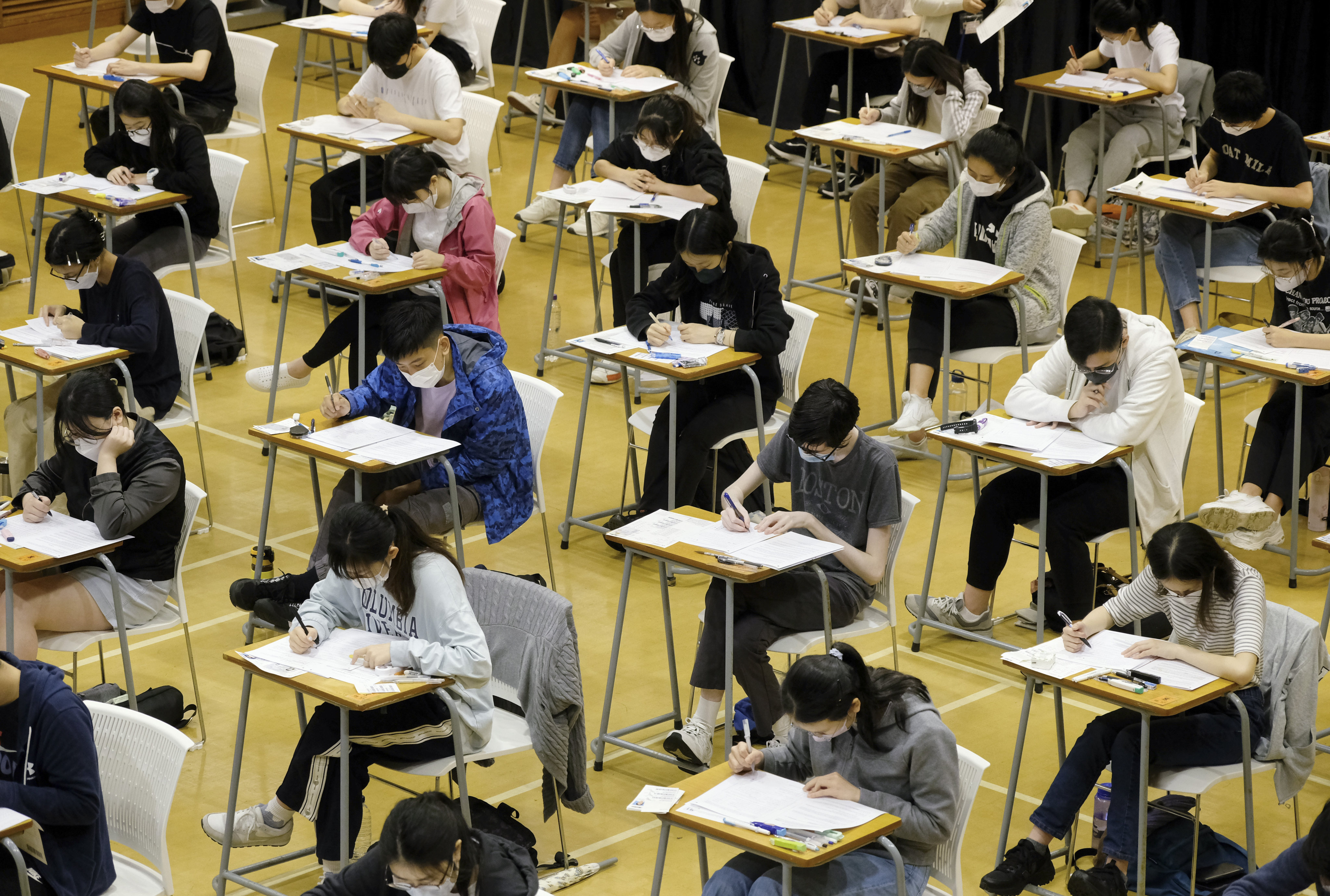 Pupils at Hong Kong University Graduate Association College get their heads down on Monday for the English paper of the Diploma of Secondary Education exams. Photo: Handout