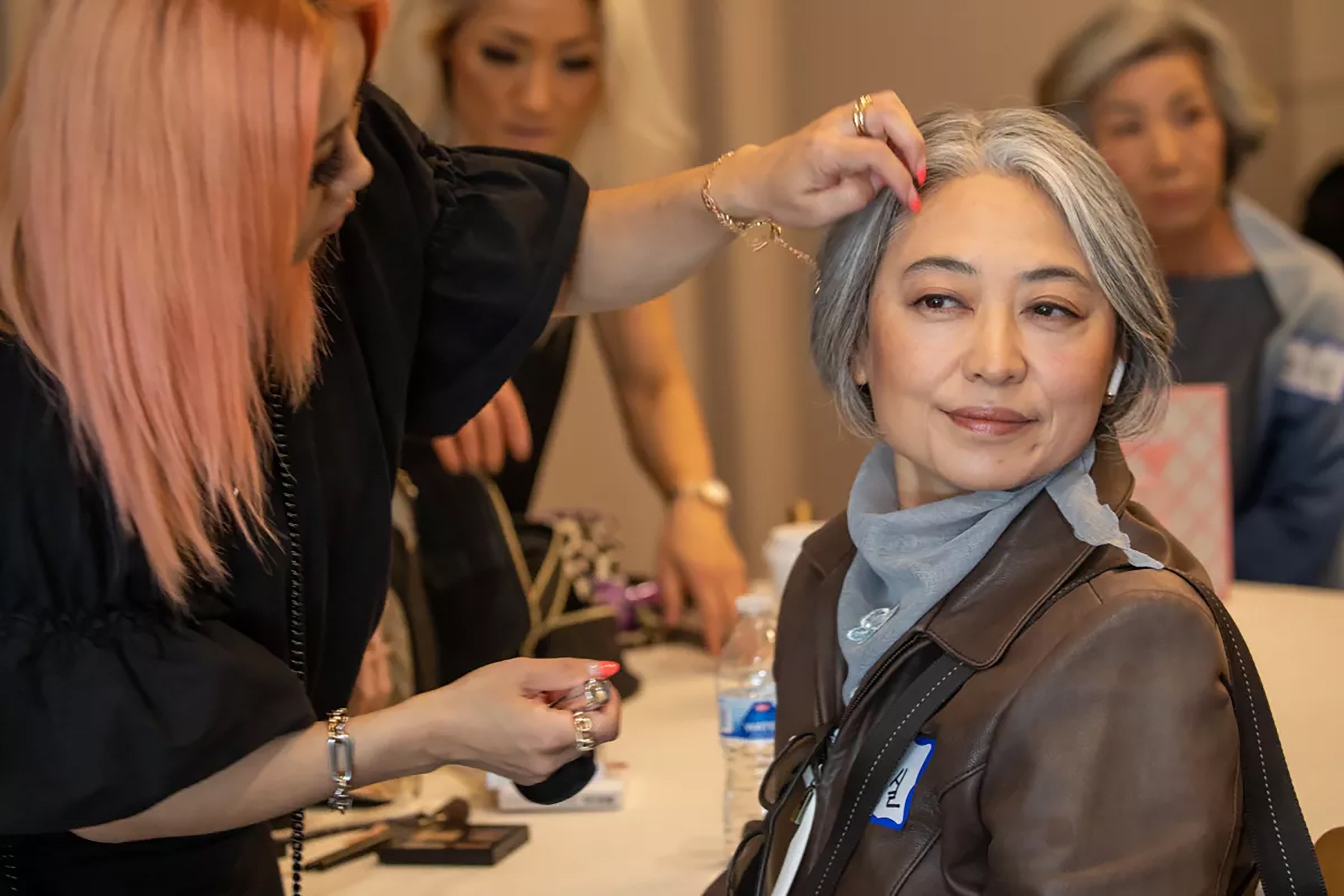 Makeup artist Junyoung McArdle, left, helps Grace Ju, 55, ready for Silver Models USA senior model audition (age 55+) at the Line LA Hotel. Photo: TNS