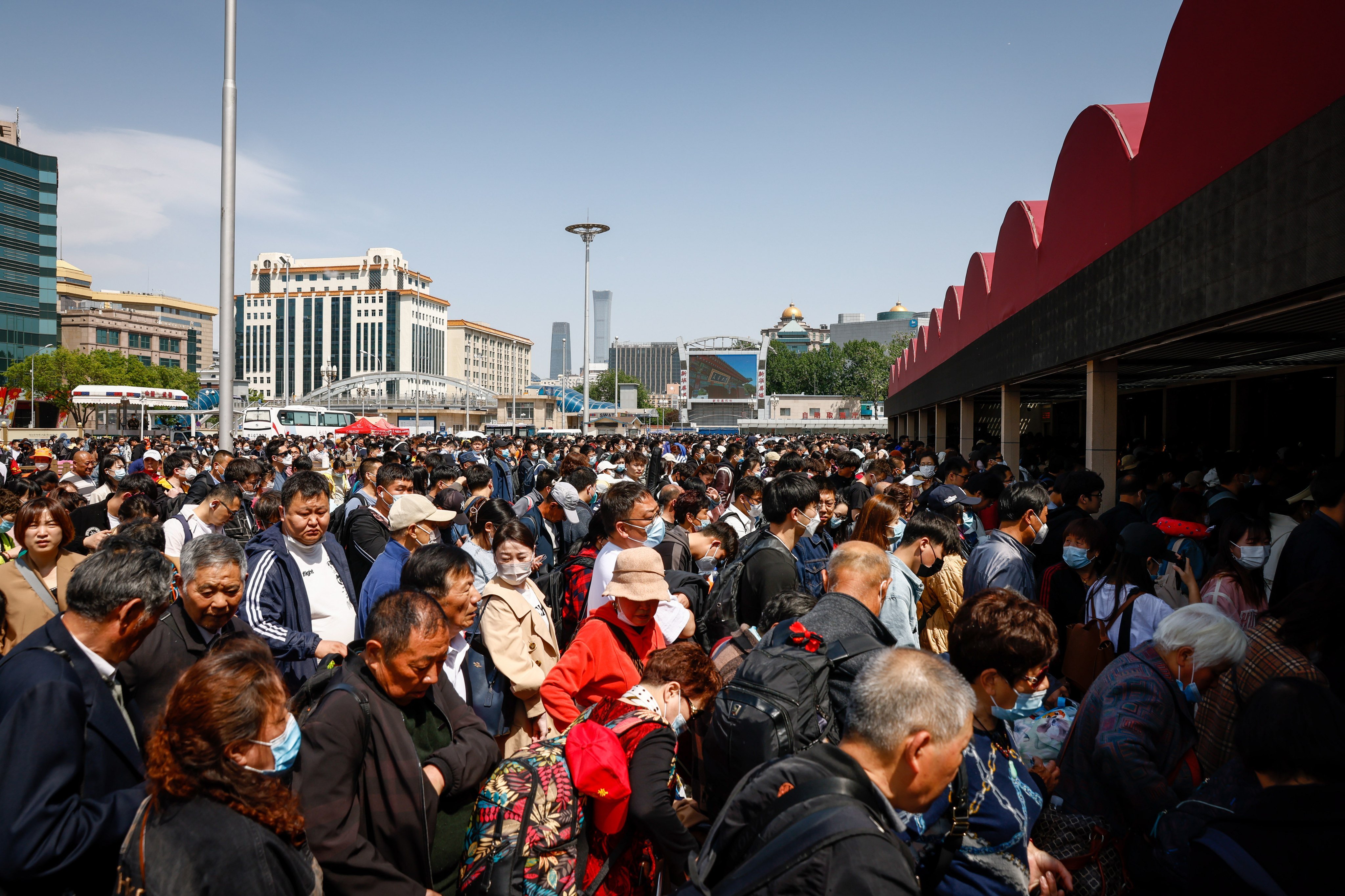 Passengers wait to enter Beijing Railway Station on Saturday. Photo: EPA-EFE