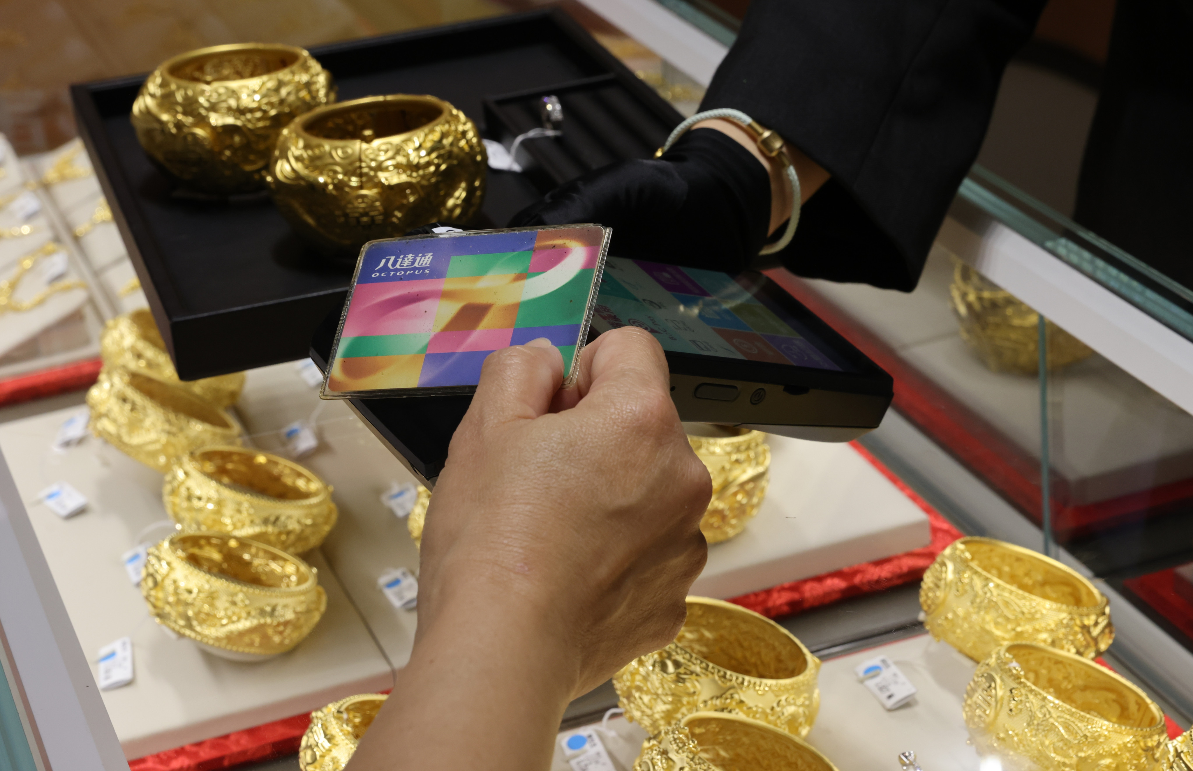 A shopper uses their consumption voucher to buy jewellery. Photo: May Tse