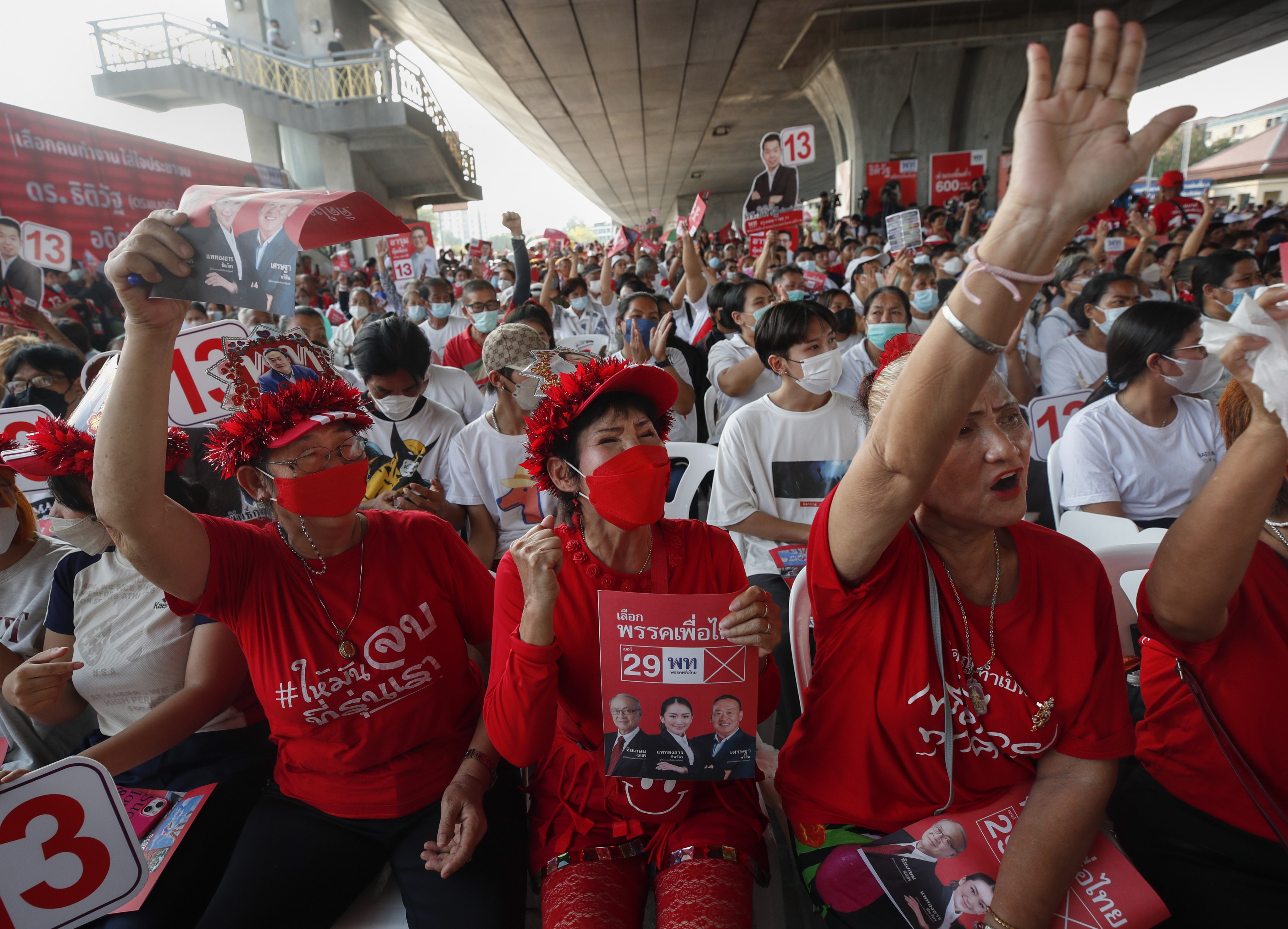 Supporters of the Pheu Thai party cheer during an election campaign rally in Bangkok. Photo: EPA-EFE