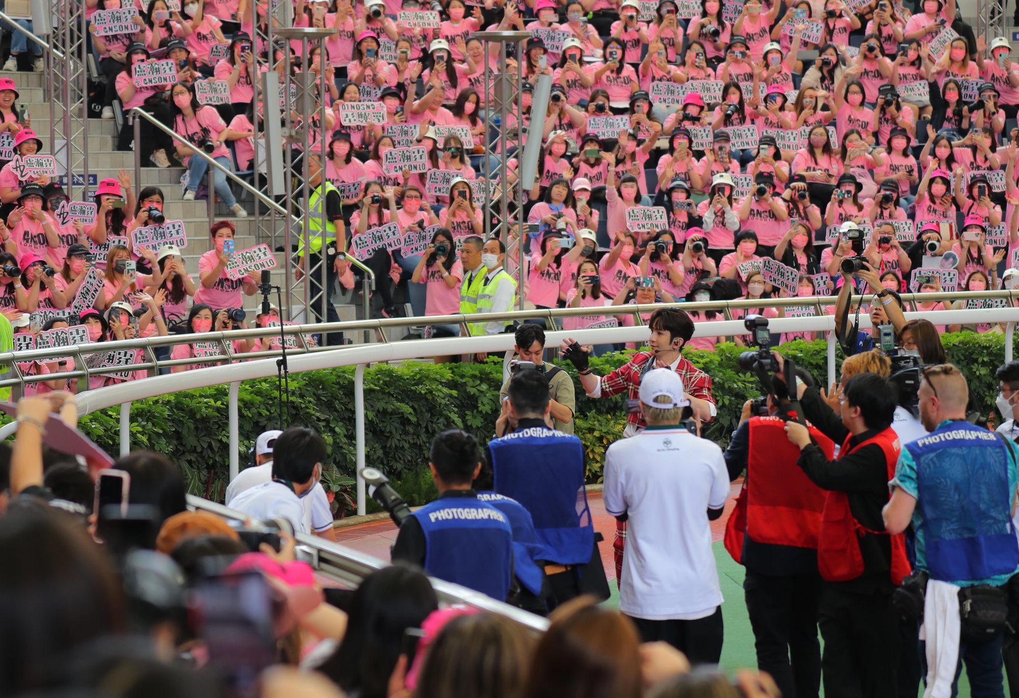 Cantopop singer Anson Lo performs to thousands of fans in Sha Tin’s parade ring on Champions Day.