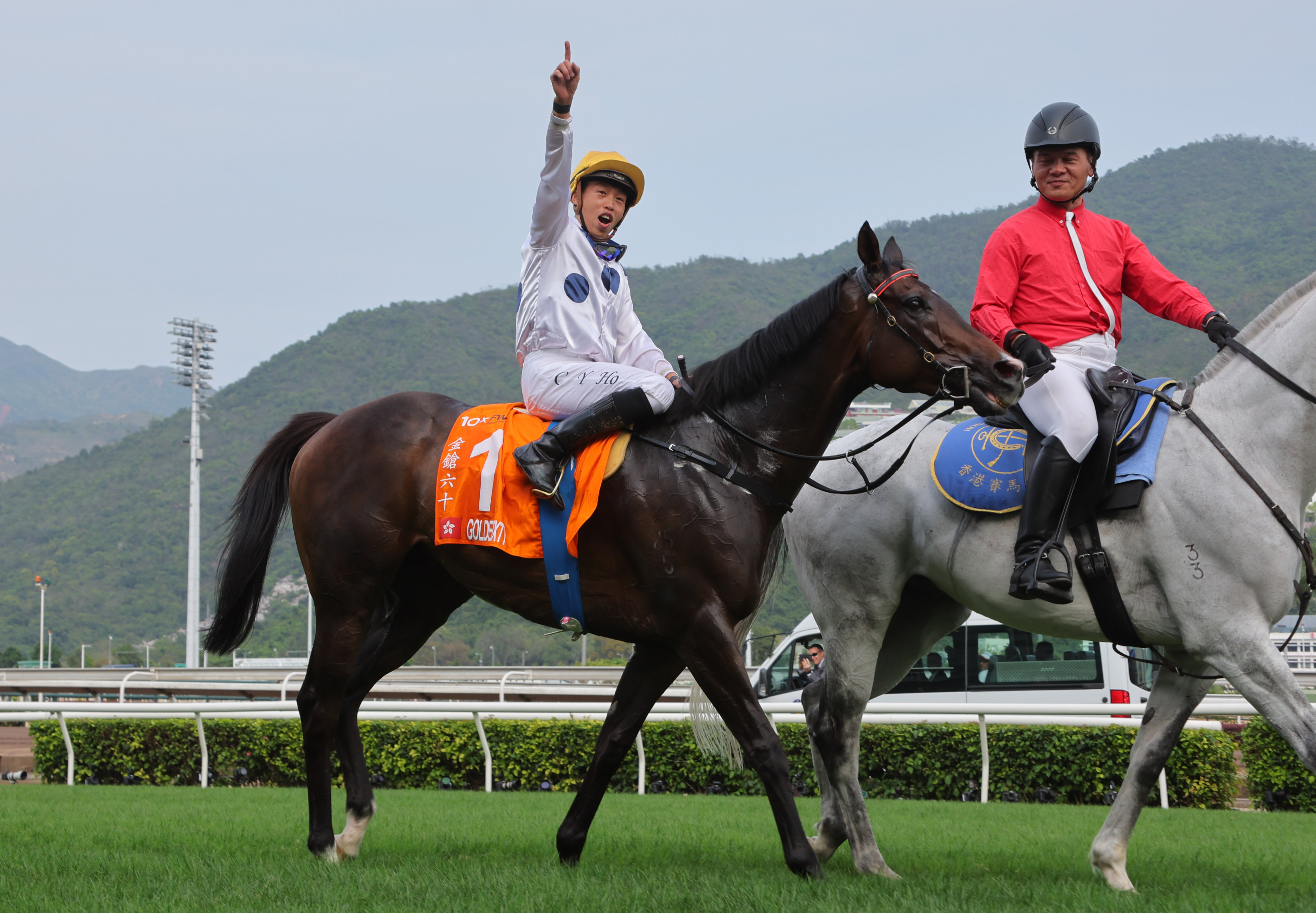 An ecstatic Vincent Ho celebrates Golden Sixty’s victory in the Champions Mile at Sha Tin on Sunday. Photos: Kenneth Chan