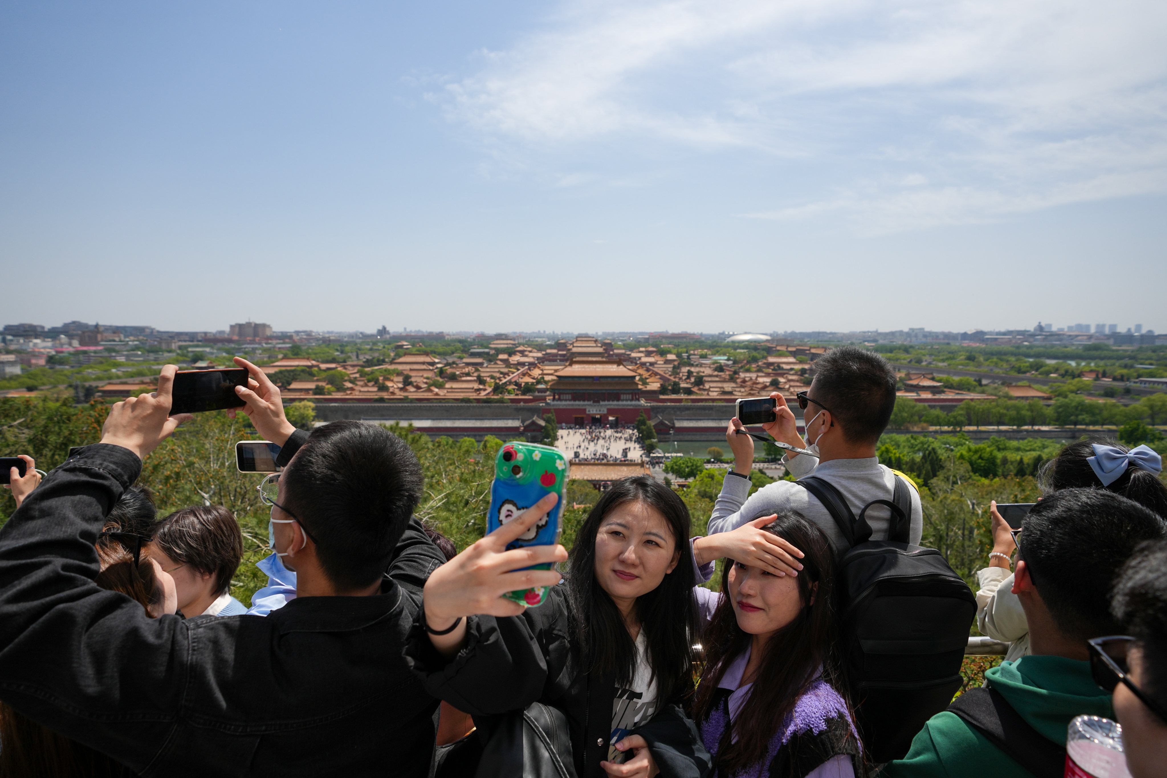 Tourists enjoy the scenery at Jingshan Park in Beijing during the Labour Day holiday. Photo: Xinhua