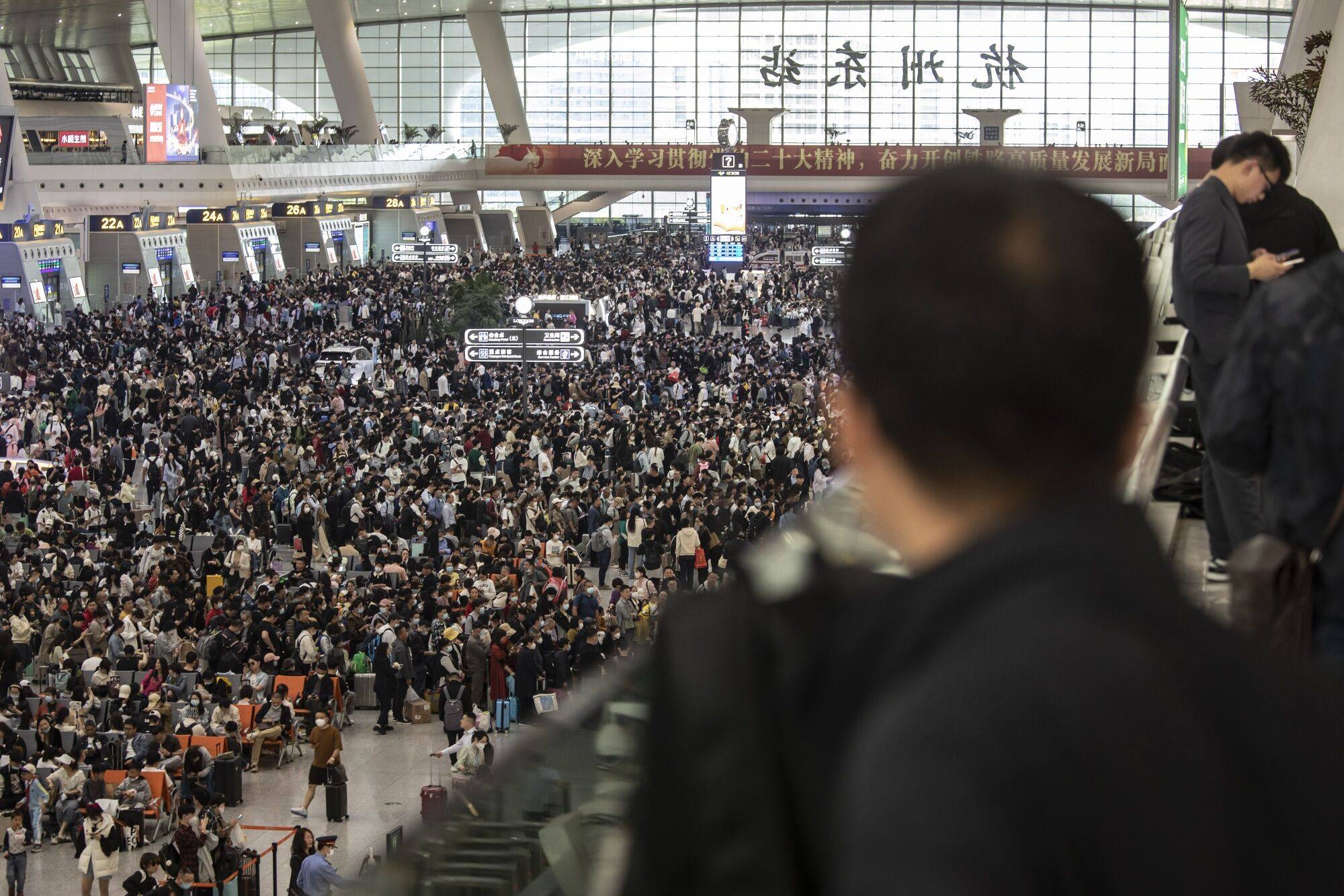 Travellers in the departure hall at Hangzhou East railway station on April 27, ahead of the golden week holiday. Photo: Bloomberg