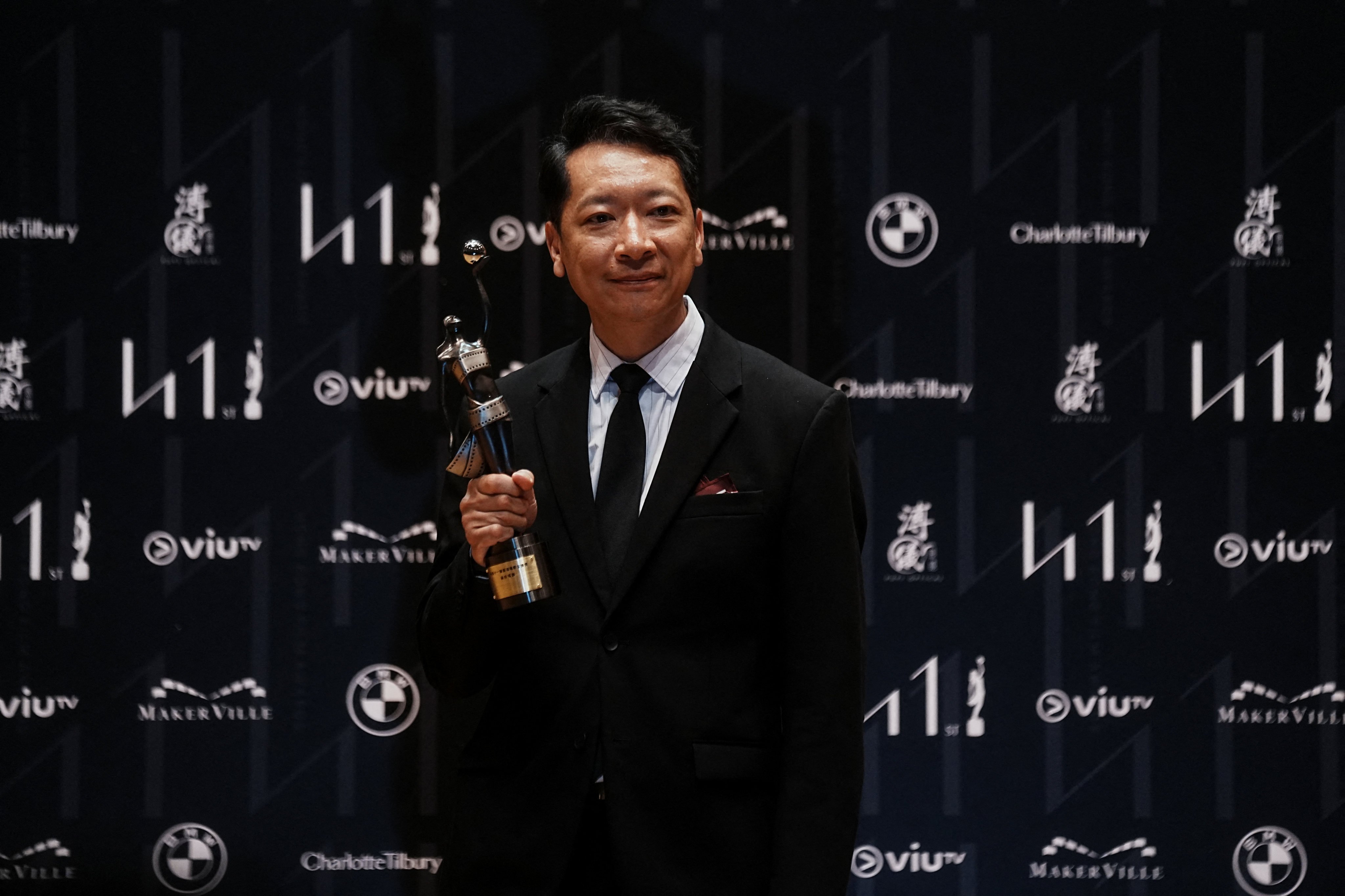 Co-director William Kwok poses with his trophy at the 41st Hong Kong Film Awards in Hong Kong. Photo: Reuters