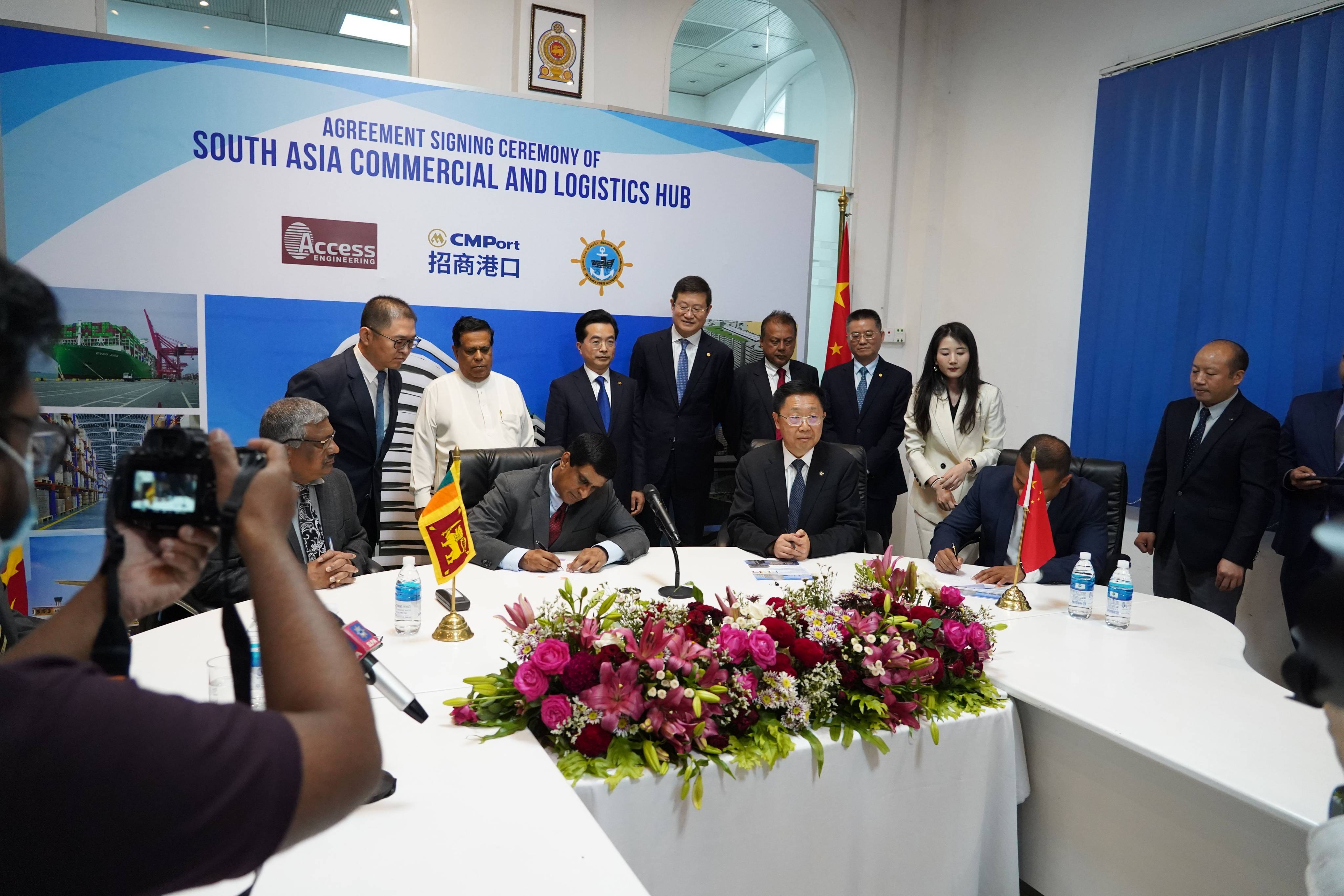 Representatives of Sri Lanka Ports Authority, a local civil engineering enterprise, and China Merchants Port Holdings at a signing ceremony of an agreement to jointly build a commercial and logistics hub at Colombo Port. Photo: Xinhua