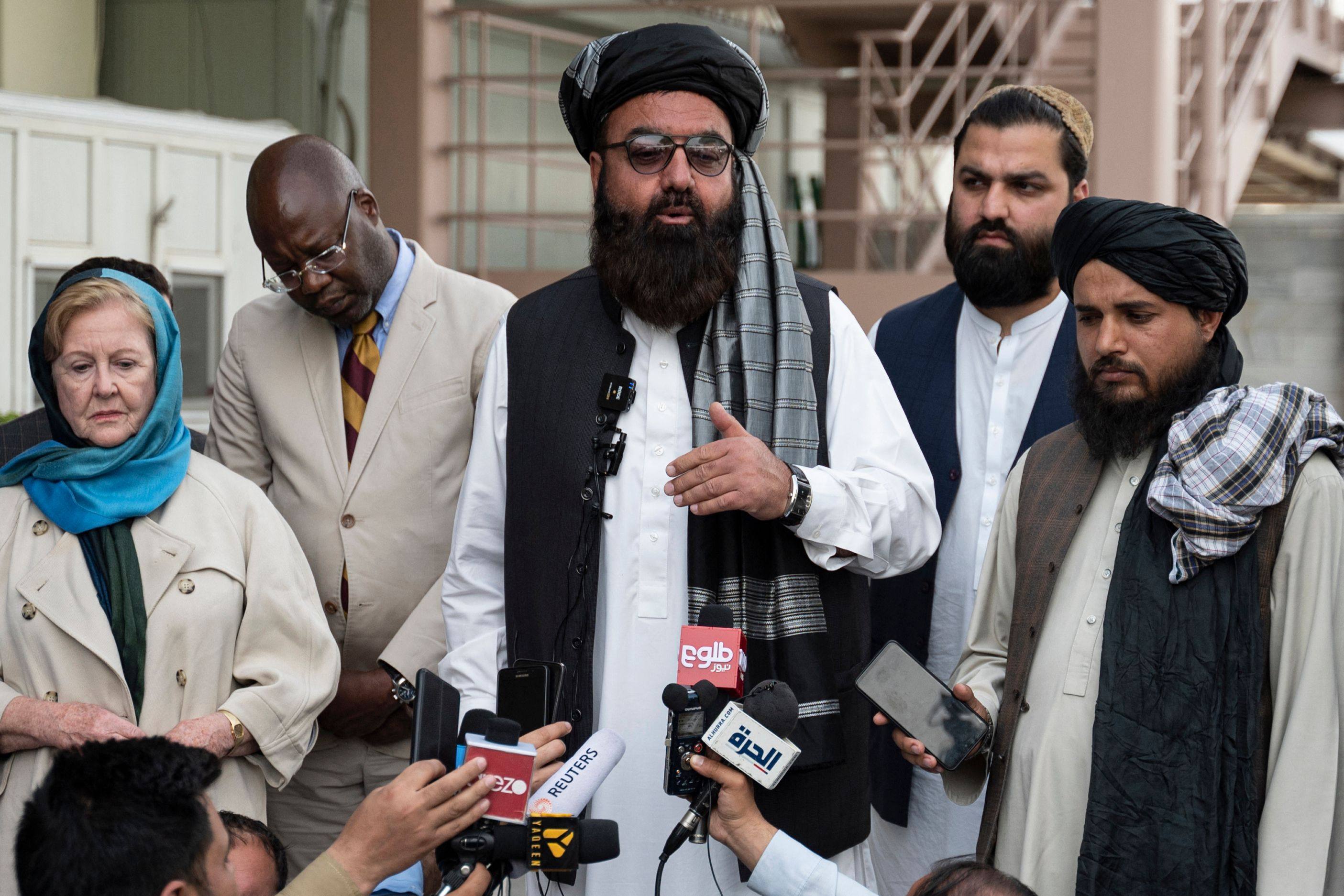 The Taliban government’s deputy minister for refugees Mohammad Arsala Kharoti, centre, speaks to the media as the United Nations assistant secretary-general and assistant high commissioner for protection (UNHCR) Gillian Triggs watches at the airport in Kabul on April 30, 2023. Photo: AFP
