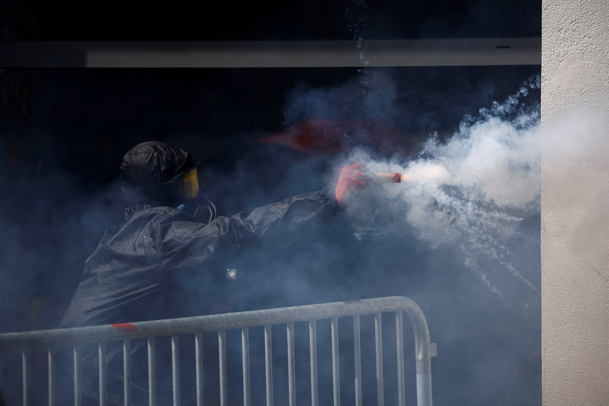 A demonstrator fires fireworks towards the police during the traditional May Day labour march. Photo: Reuters