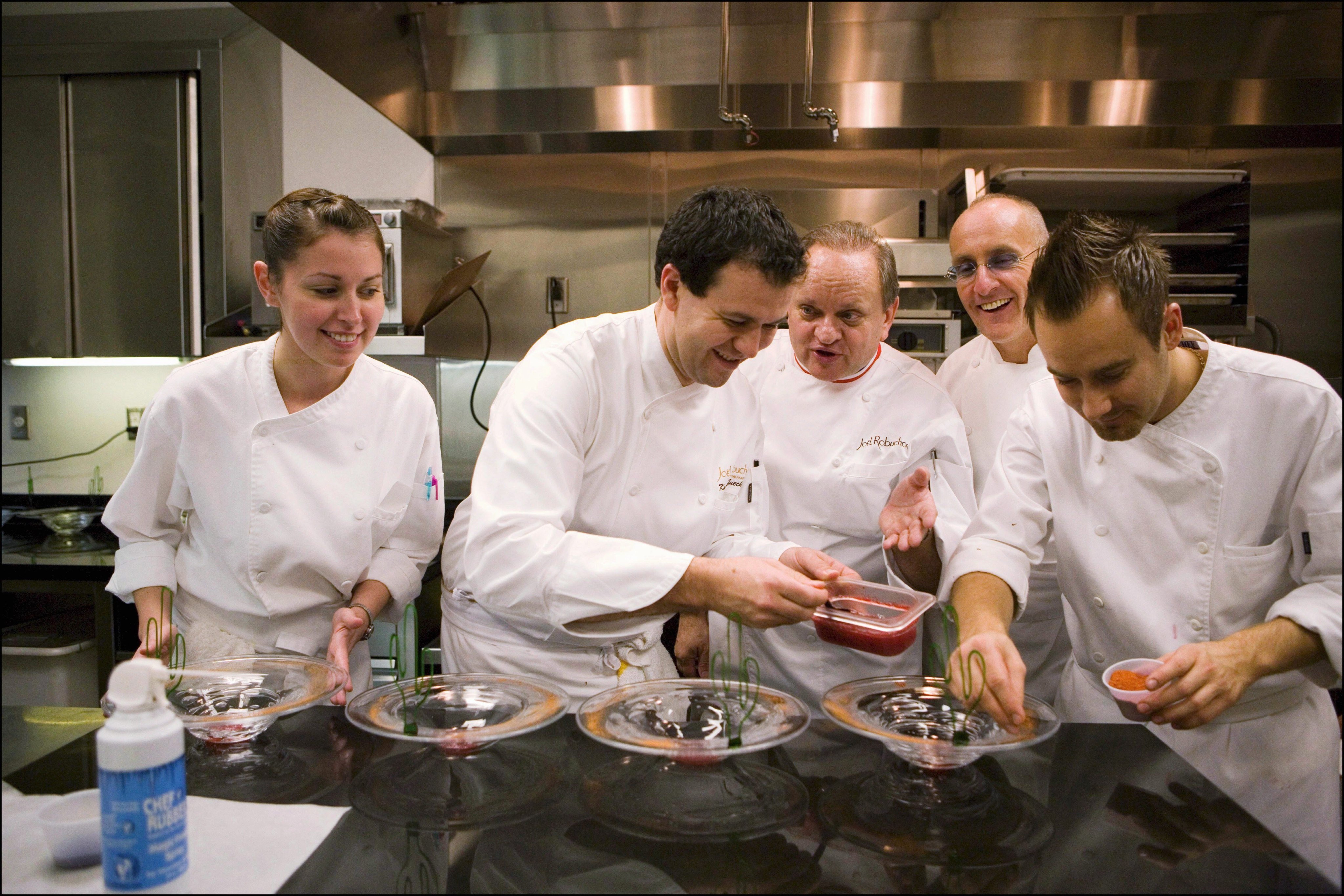 Chef Joel Robuchon (centre) with his team at his restaurant The Mansion, in Las Vegas, in 2005. Our obsession with celebrity chefs overlooks the teams behind them that contribute to restaurants’ Michelin-star status. Photo: Getty Images