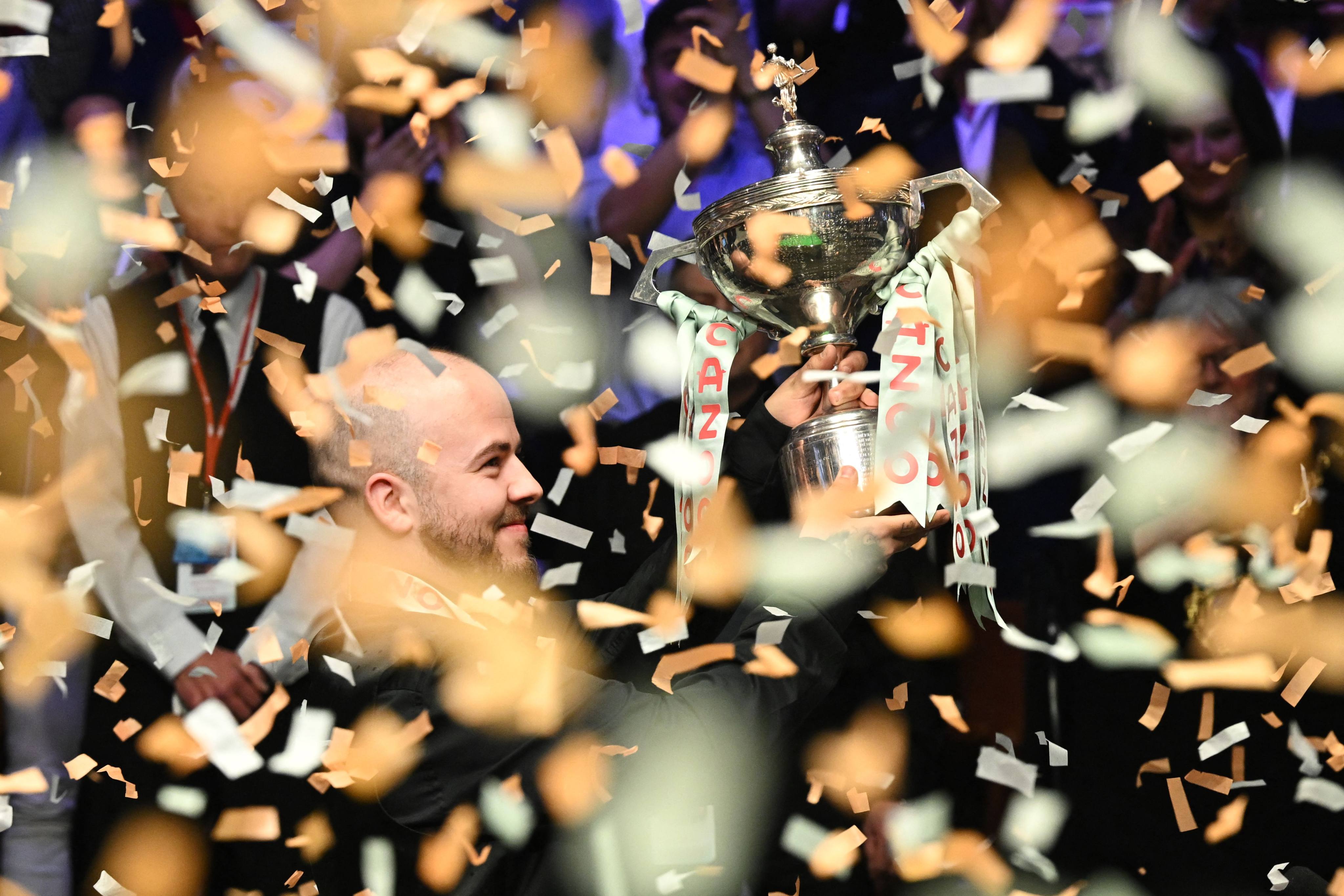 Belgium’s Luca Brecel celebrates with the trophy after winning the World Championship at the Crucible. Photo: AFP