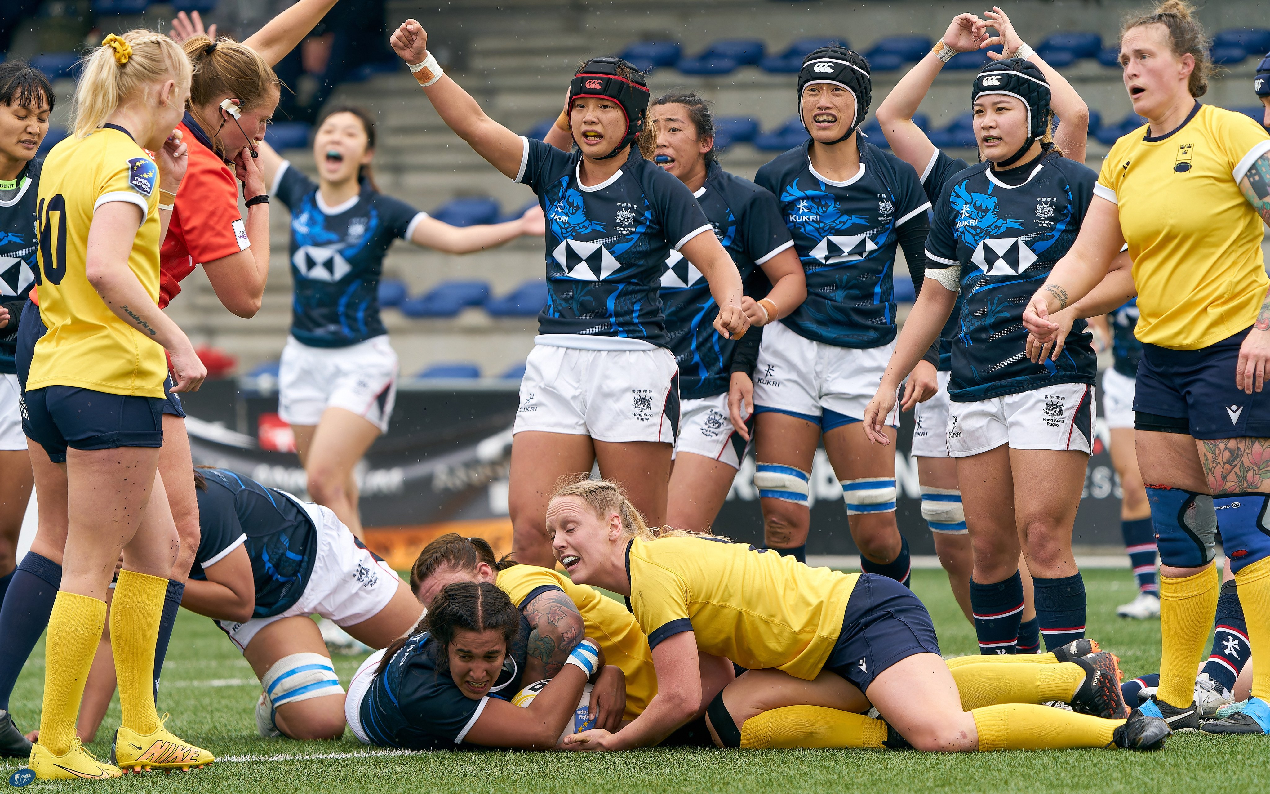 Hong Kong lock Roshini Turner scores her side’s first try against Sweden at the National Rugby Centre Stadium in Amsterdam. Photo: Erik den Burger/HKRU