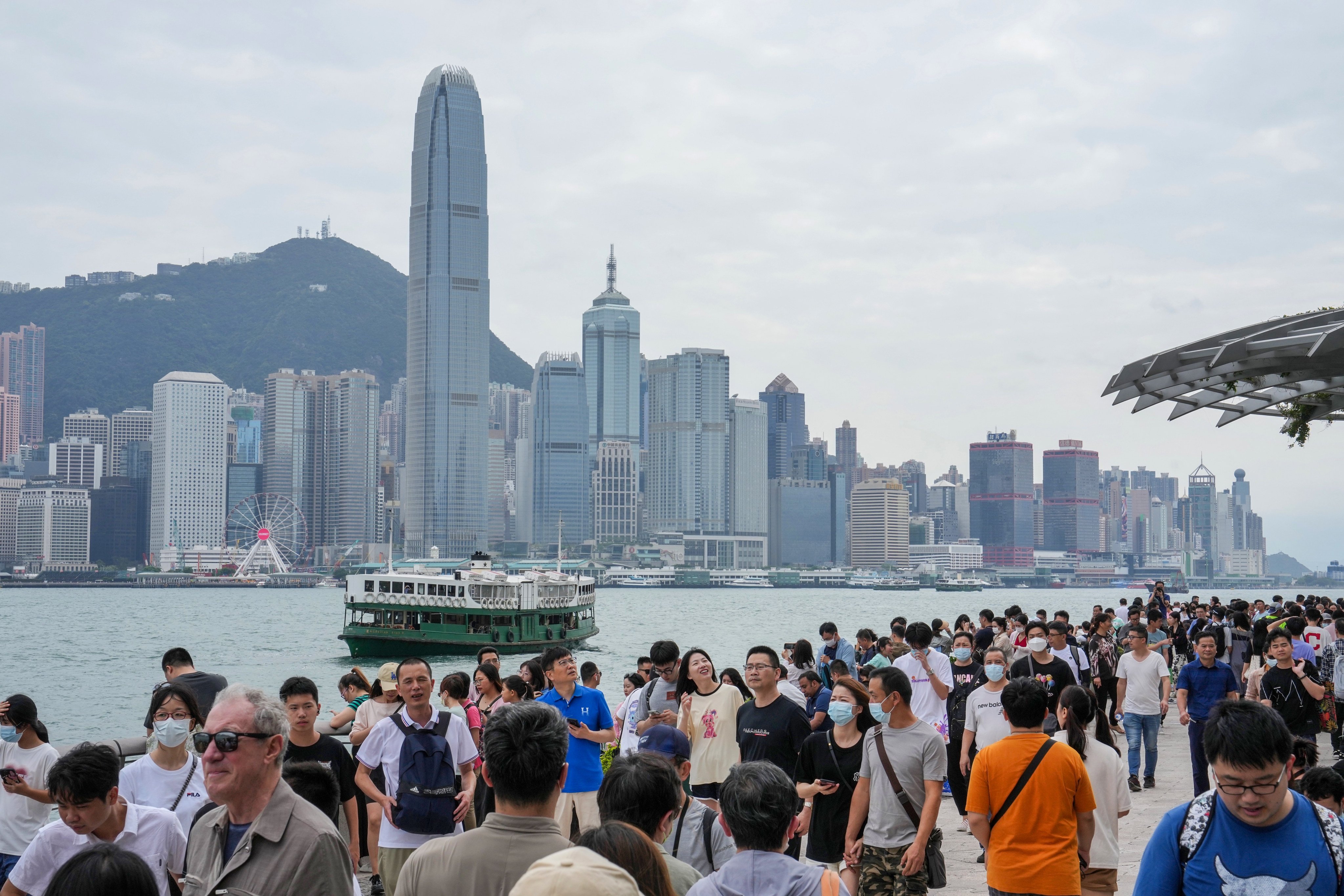 Tourists pack Hong Kong’s waterfront at Tsim Sha Tsui. Photo: Elson Li