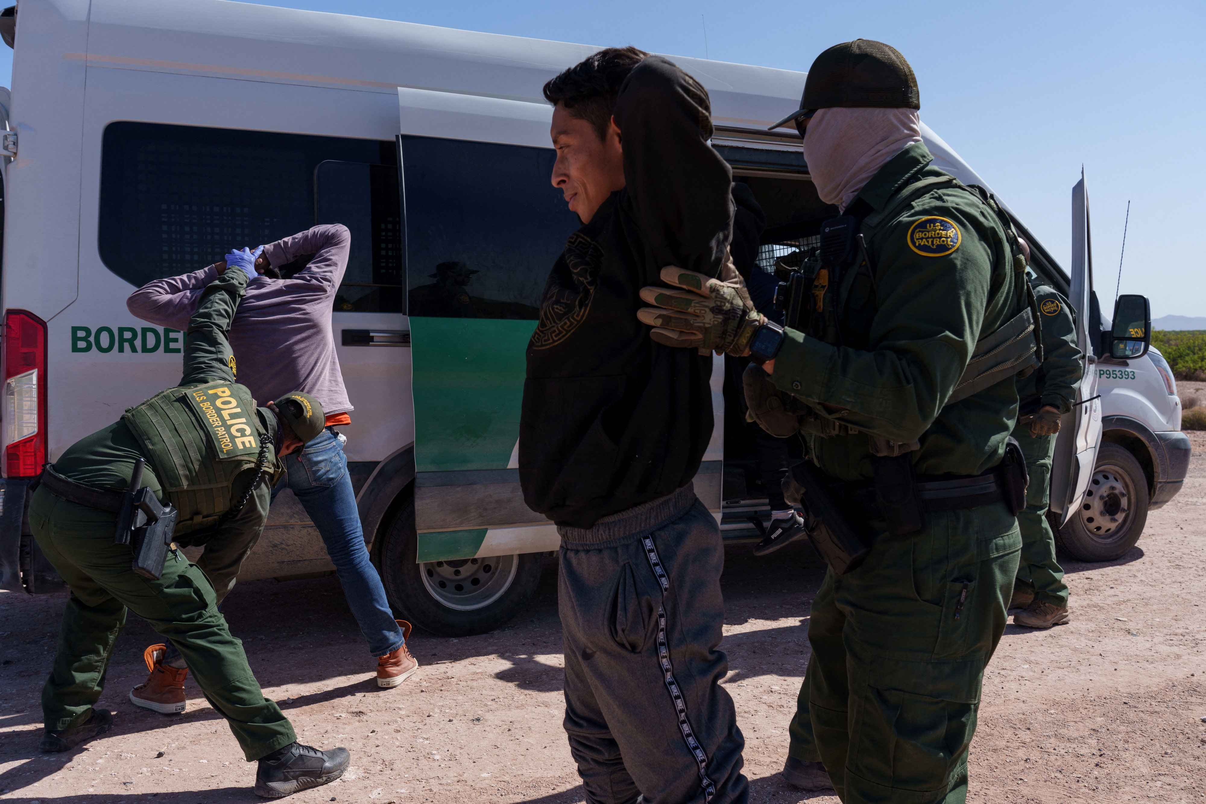 Border Patrol agents  in Santa Teresa, New Mexico, search migrants who were trying to enter the US undetected in April. Photo: Reuters