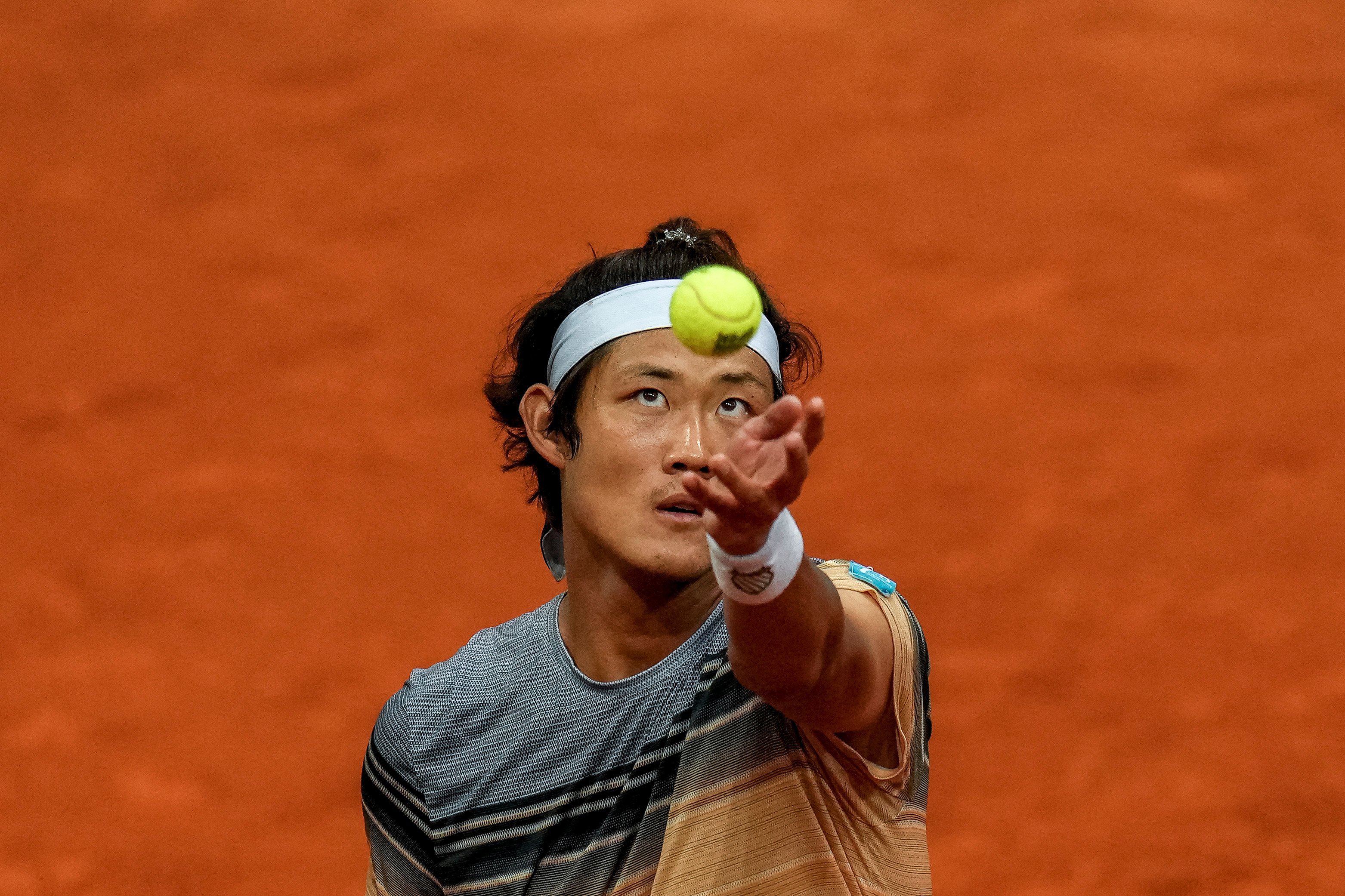 Zhang Zhizhen to Taylor Fritz during their match at the Madrid Open. Photo: AP