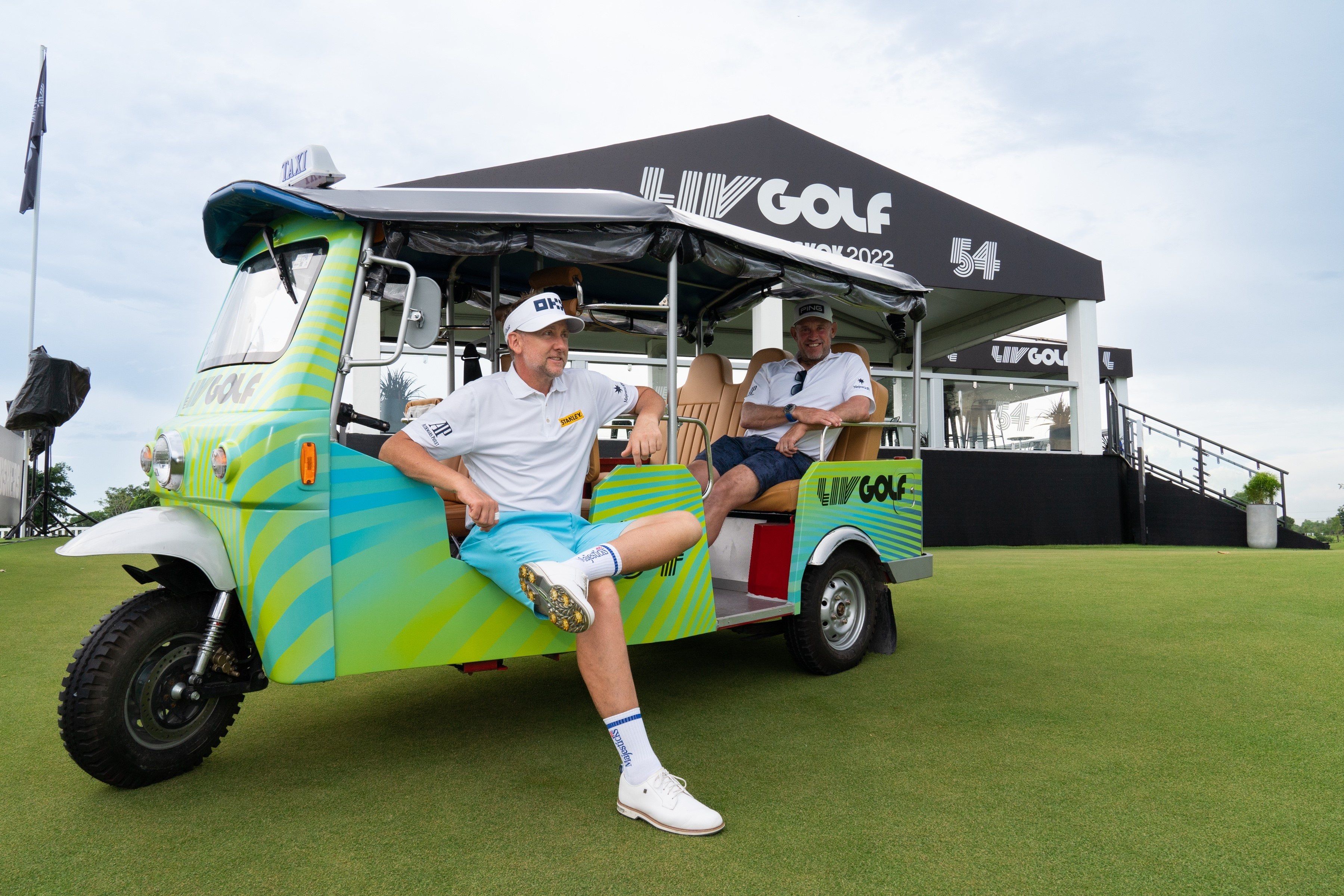 Ian Poulter and Lee Westwood sitting in Tuktuks ahead at the LIV Golf Invitational Bangkok. Photo: LIV Golf