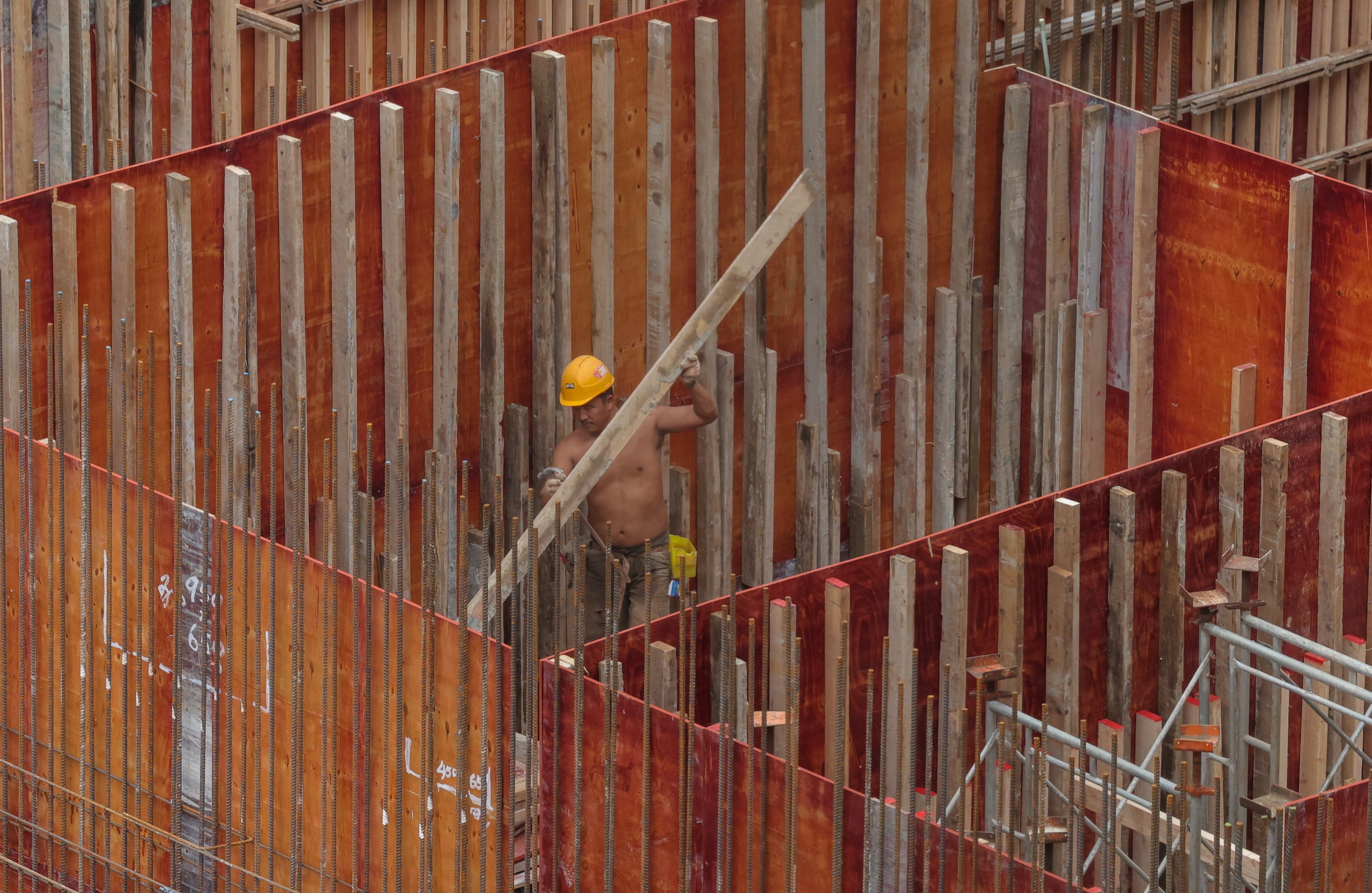 A site worker erecting formwork at a construction site in Mong Kok on April 4. Photo: Jelly Tse
