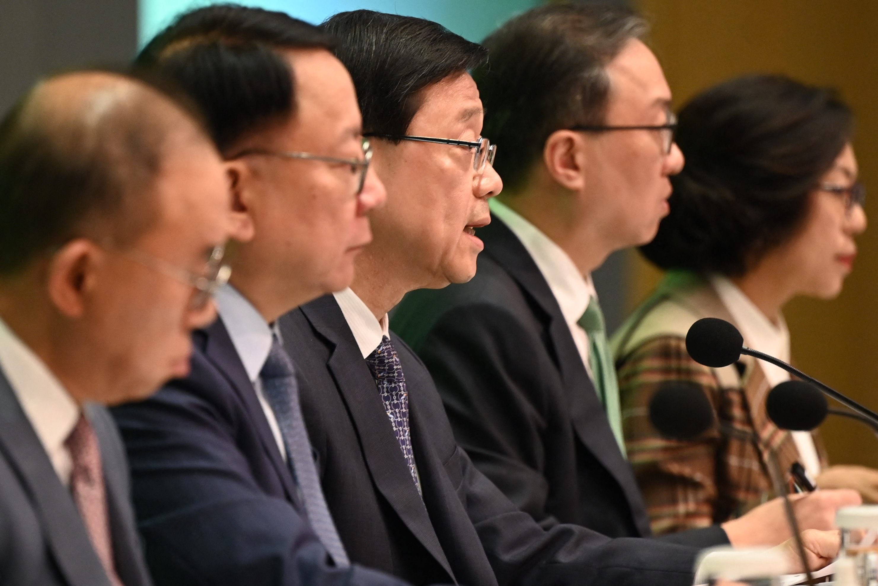 Chief Executive John Lee (centre) announces an overhaul of district councils during a press conference at the government headquarters in Hong Kong on May 2. Photo: AFP