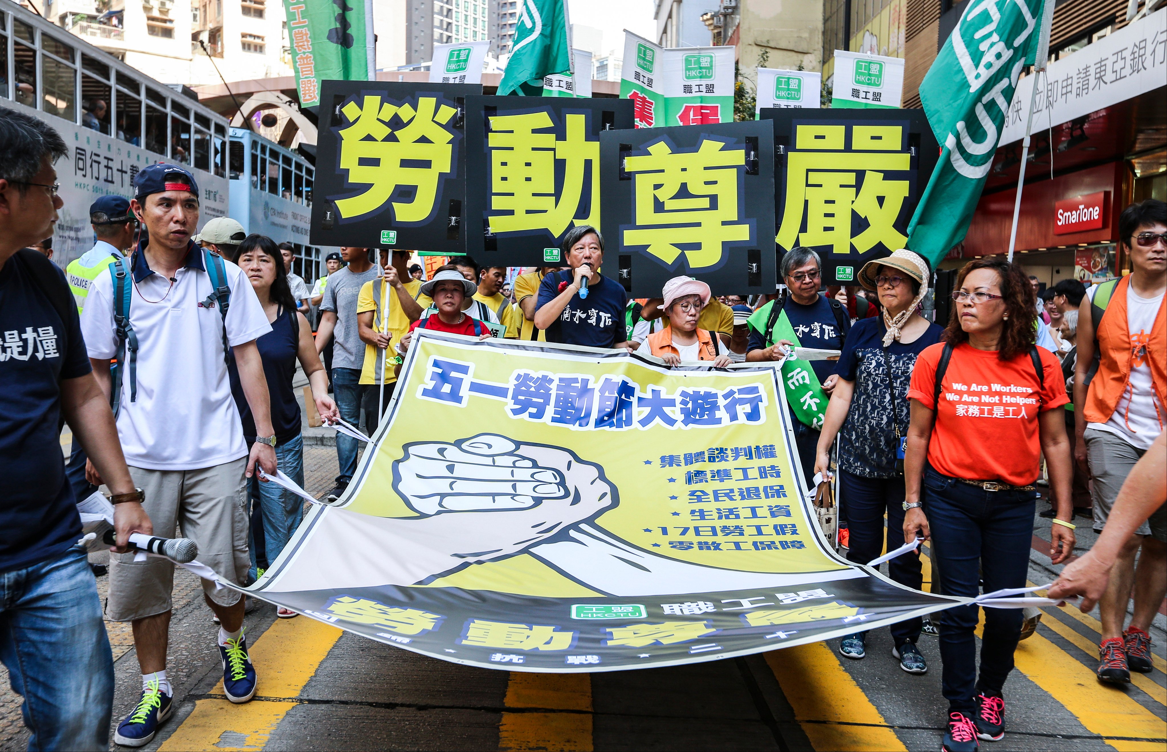 Labour unionists march in a Labour Day rally from Causeway Bay to Central, in Hong Kong, on May 1, 2017. Photo: Dickson Lee