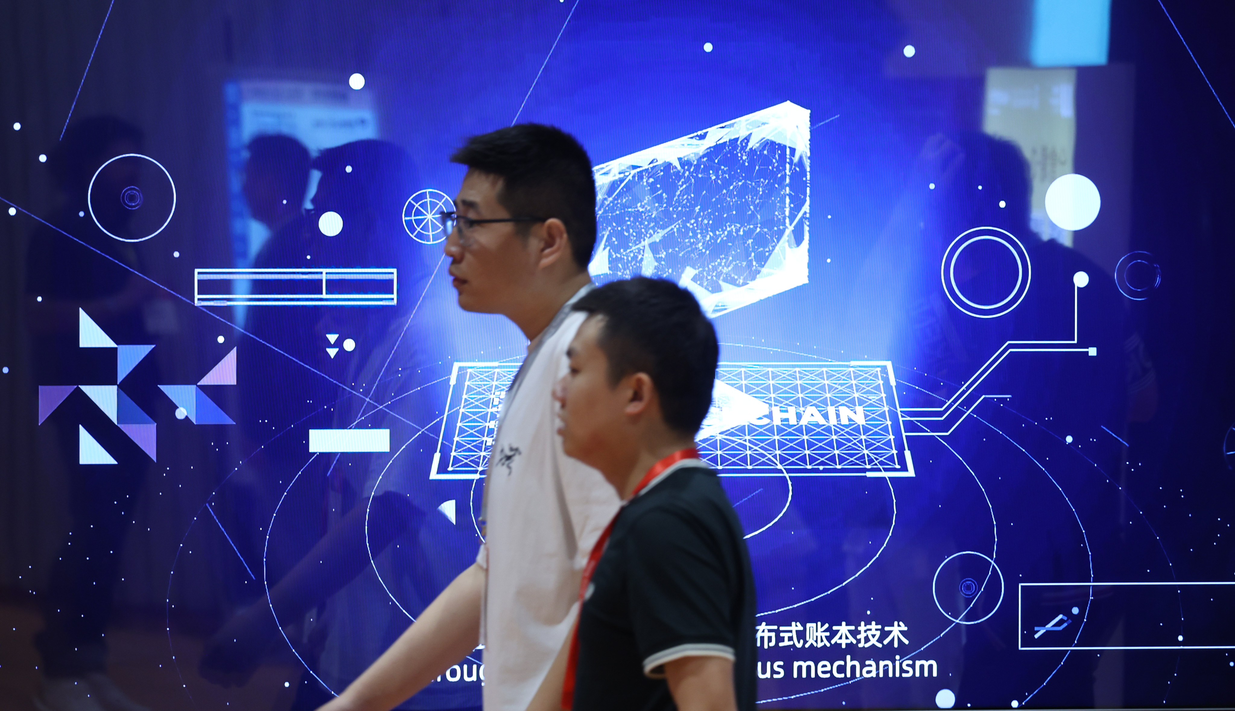 Visitors walk past a screen on blockchain at the Hong Kong Web3 Festival at the Convention and Exhibition Centre in Wan Chai on April 14. Photo: Yik Yeung-man