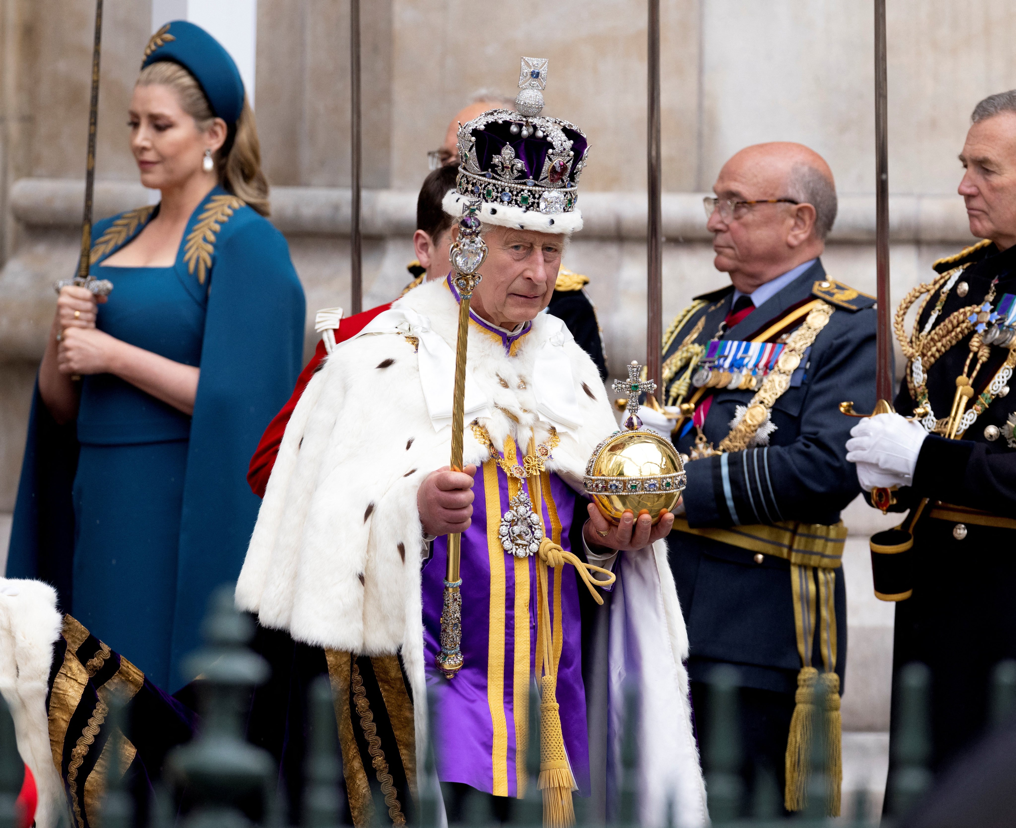 Britain’s King Charles wearing the Imperial State Crown, carrying the Sovereign’s Orb and Sceptre, leaves Westminster Abbey after the Coronation Ceremonies, in London, Britain, on May 6. Photo: Reuters