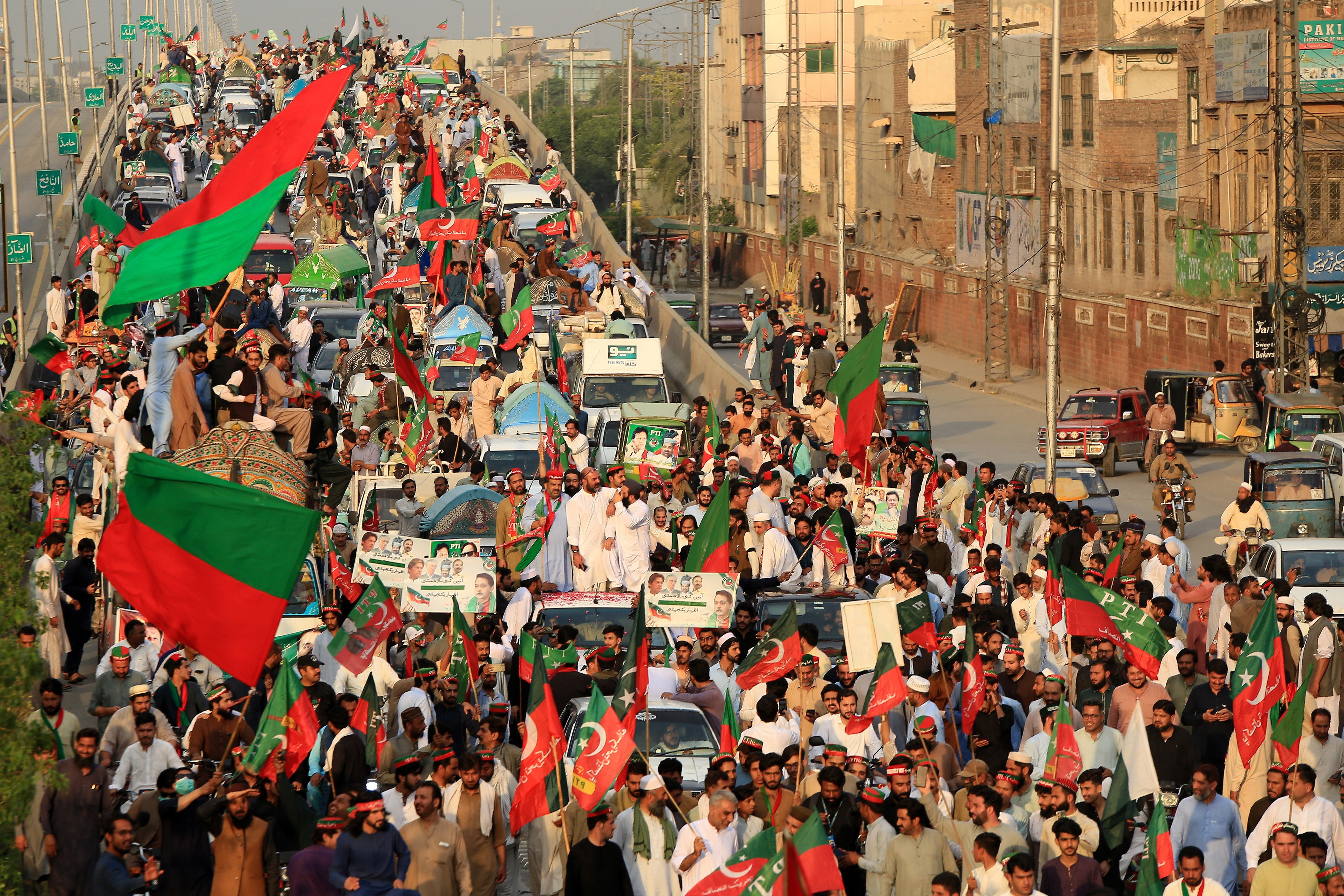 Supporters of former Prime Minister Imran Khan and his opposition Pakistan Tehreek-e-Insaf party march during a rally in Peshawar on Saturday. The victim was beaten to death at a separate rally in ultraconservative northwestern Khyber Pakhtunkhwa province. Photo: EPA-EFE