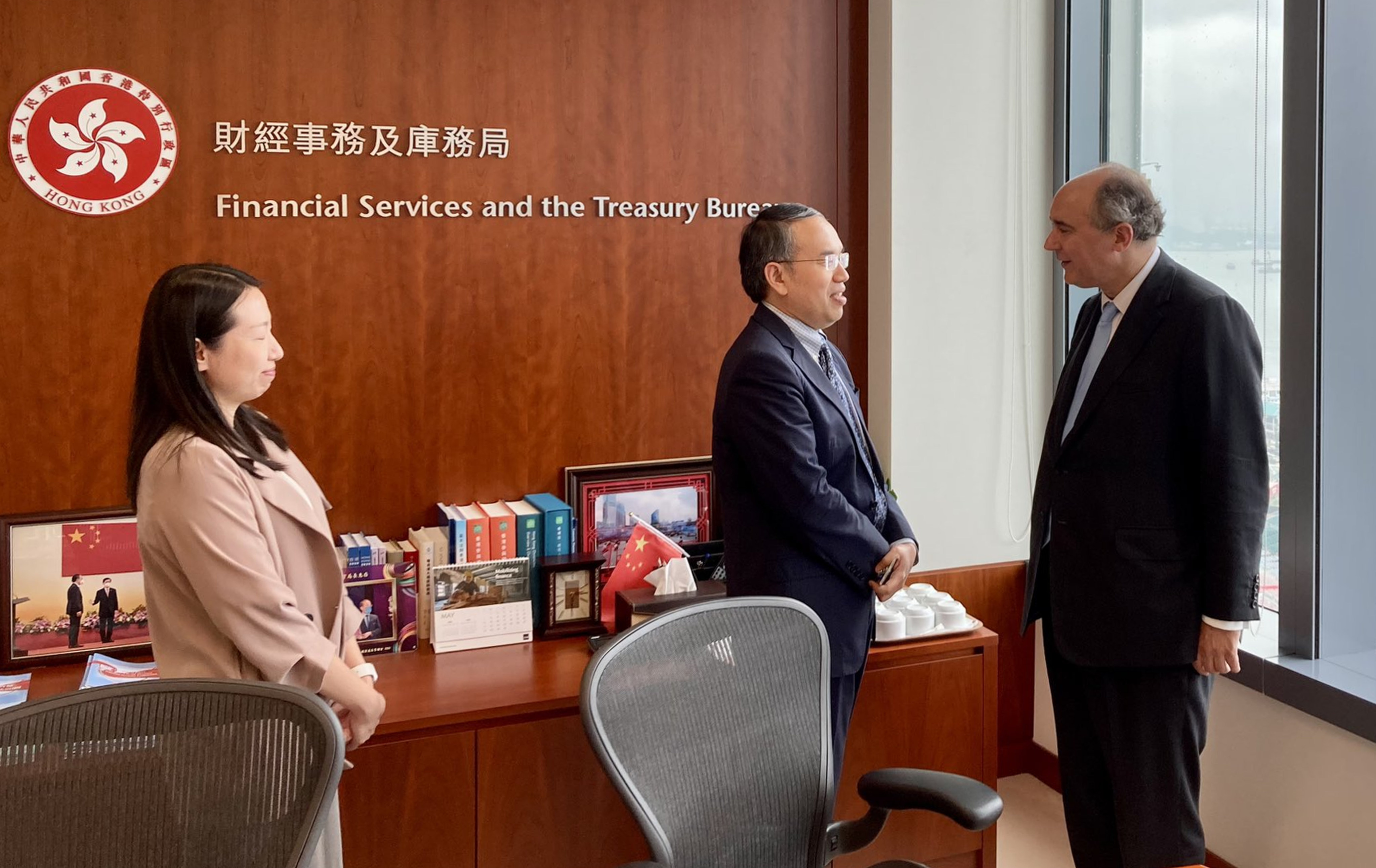 UK official Dominic Johnson (right) meets Secretary for Financial Services and the Treasury Christopher Hui. Photo: Handout 