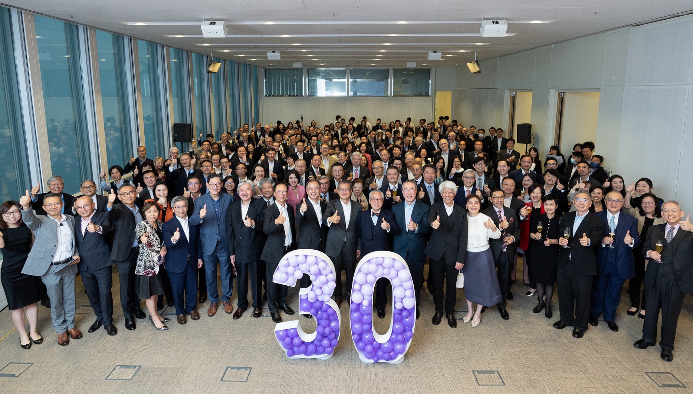 Former and current HKMA CEOs and the city’s financial secretary get together with scores of staff and key bankers to celebrate the 30th anniversary of the HKMA. Photo: Hong Kong Monetary Authority