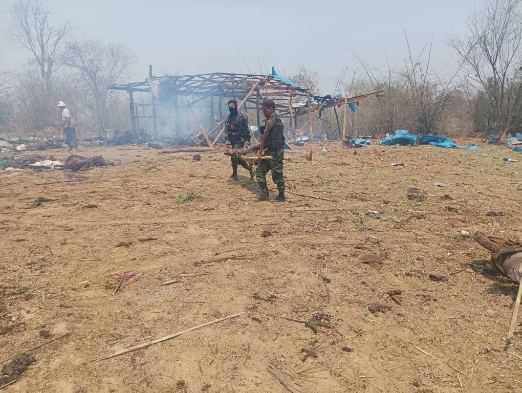 Members of Myanmar’s anti-coup ‘People’s Defence Forces’ carry the body of a victim of an airstrike by the military junta on a village in the Sagaing region in April. Over 100 people are believed to have been killed. Photo: EPA-EFE