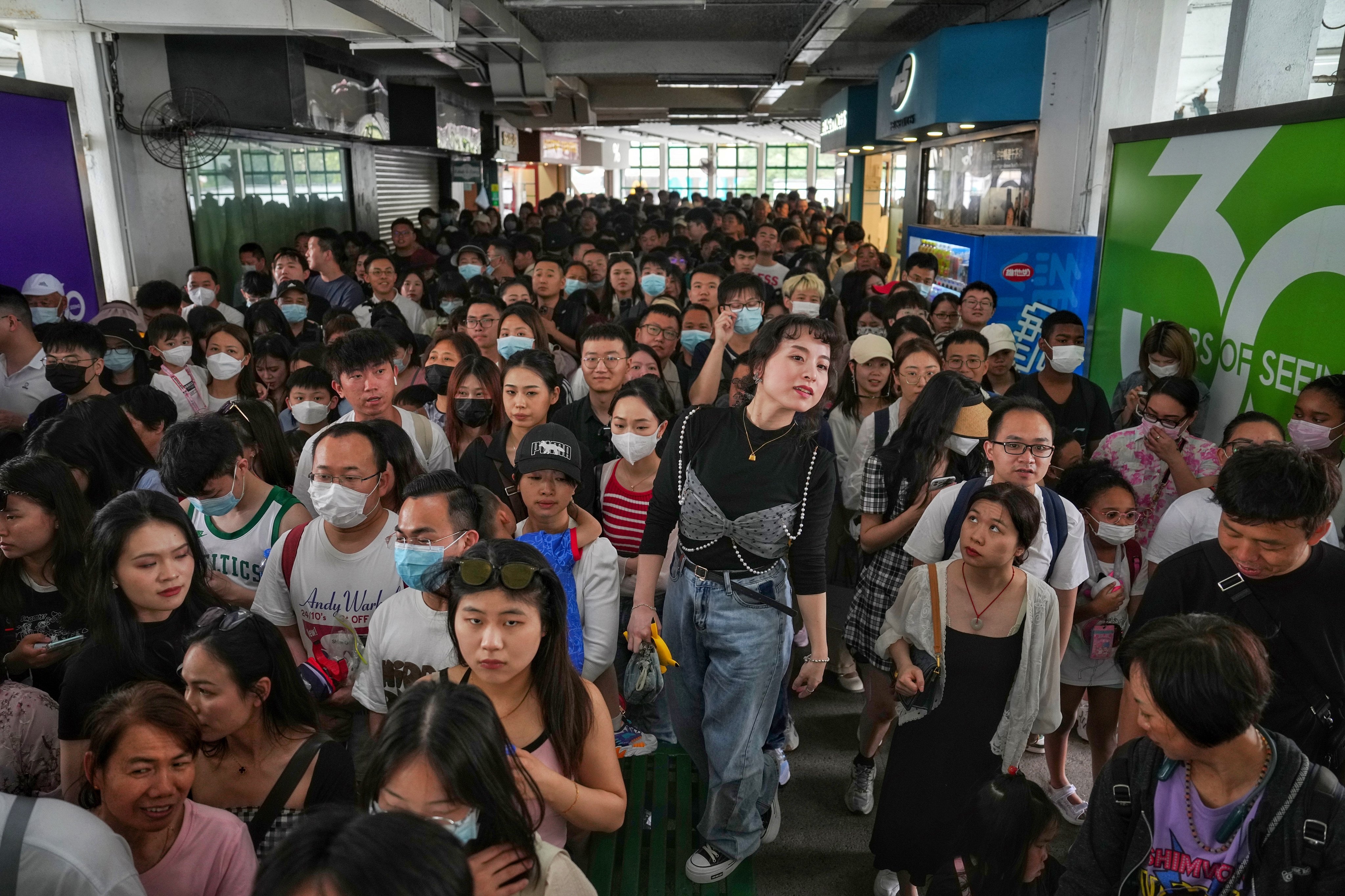 Tourists queue to take the ferry from the Tsim Sha Tsui pier on May 1. Photo: Elson Li 