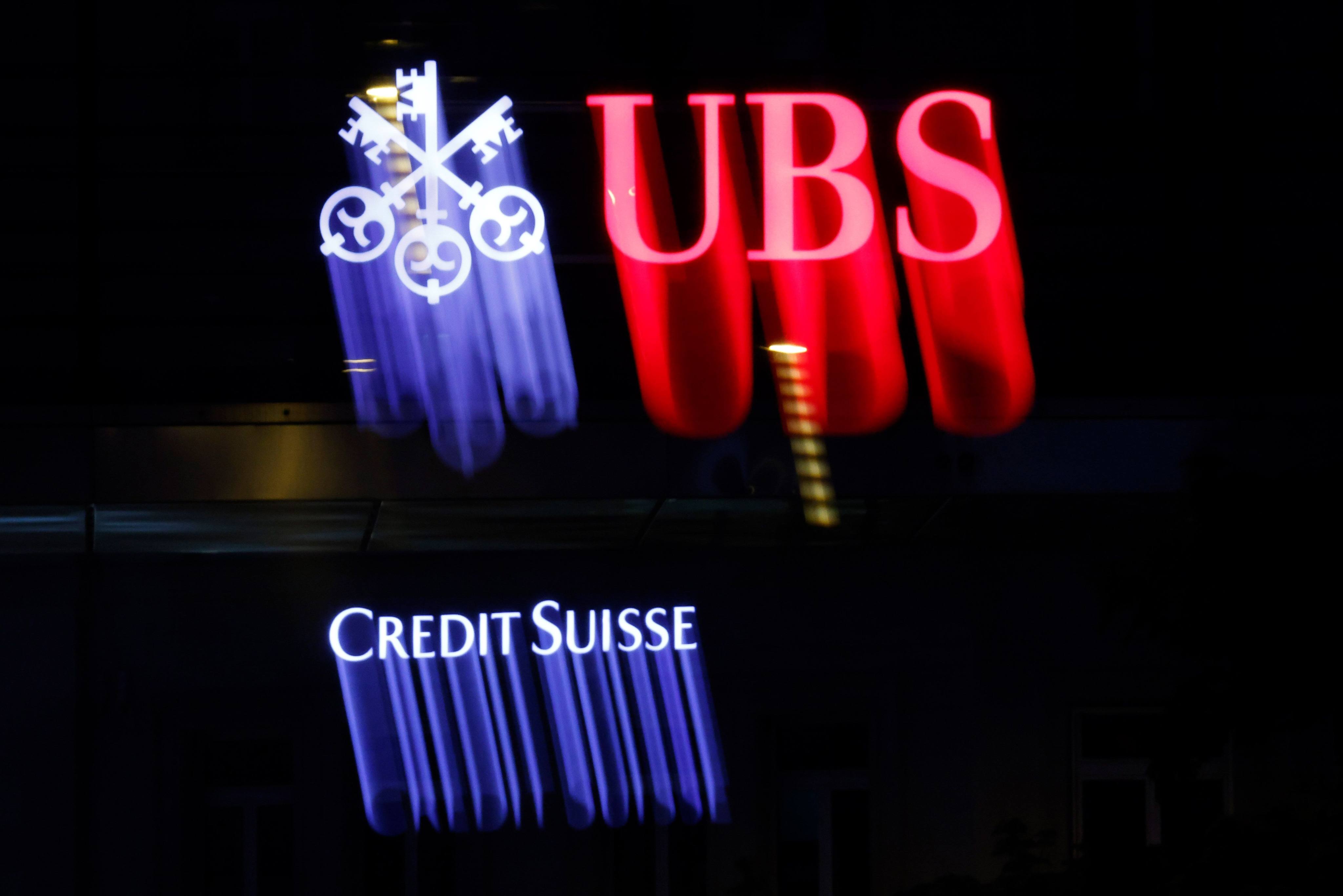 The logo of a Credit Suisse and UBS are seen in Zurich, Switzerland. Photo: Bloomberg