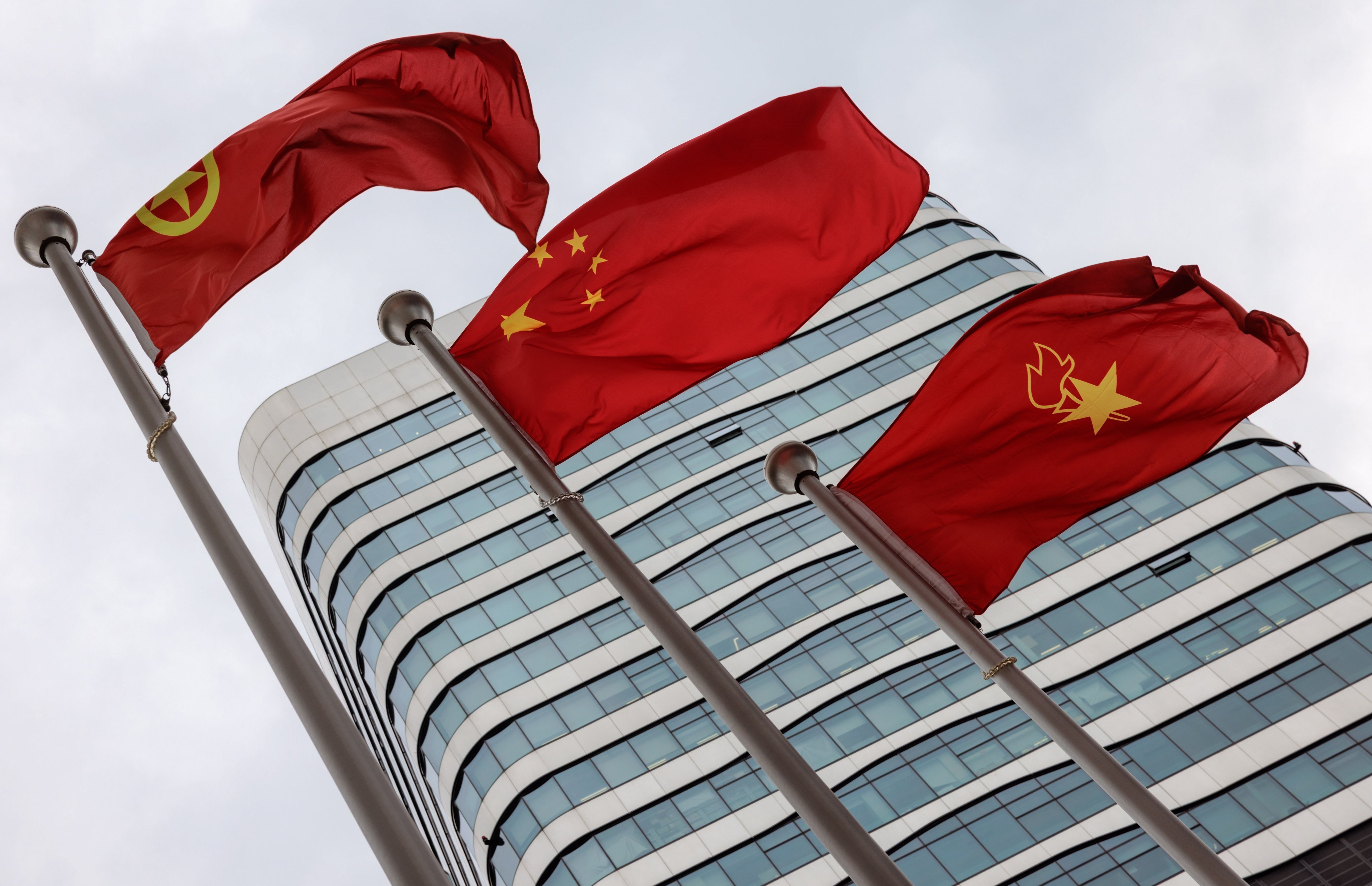 Flags stand in front of the Capvision Partners headquarters building in Shanghai, China. Photo: EPA-EFE