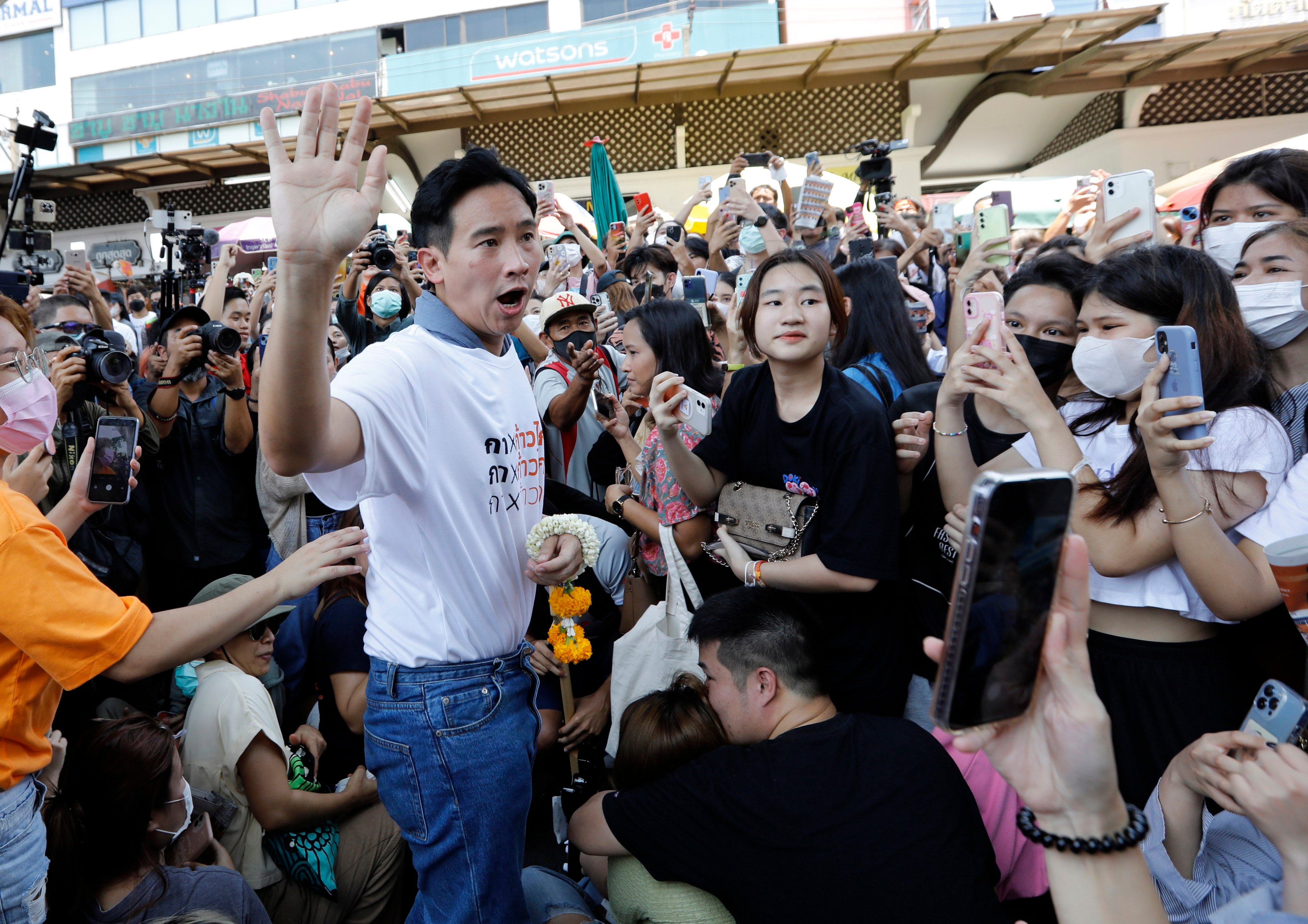 Pita Limjaroenrat (left), the Move Forward Party’s candidate for prime minister, greets supporters during a general election campaign in Bangkok, Thailand, on May 4, 2023. Photo: EPA-EFE