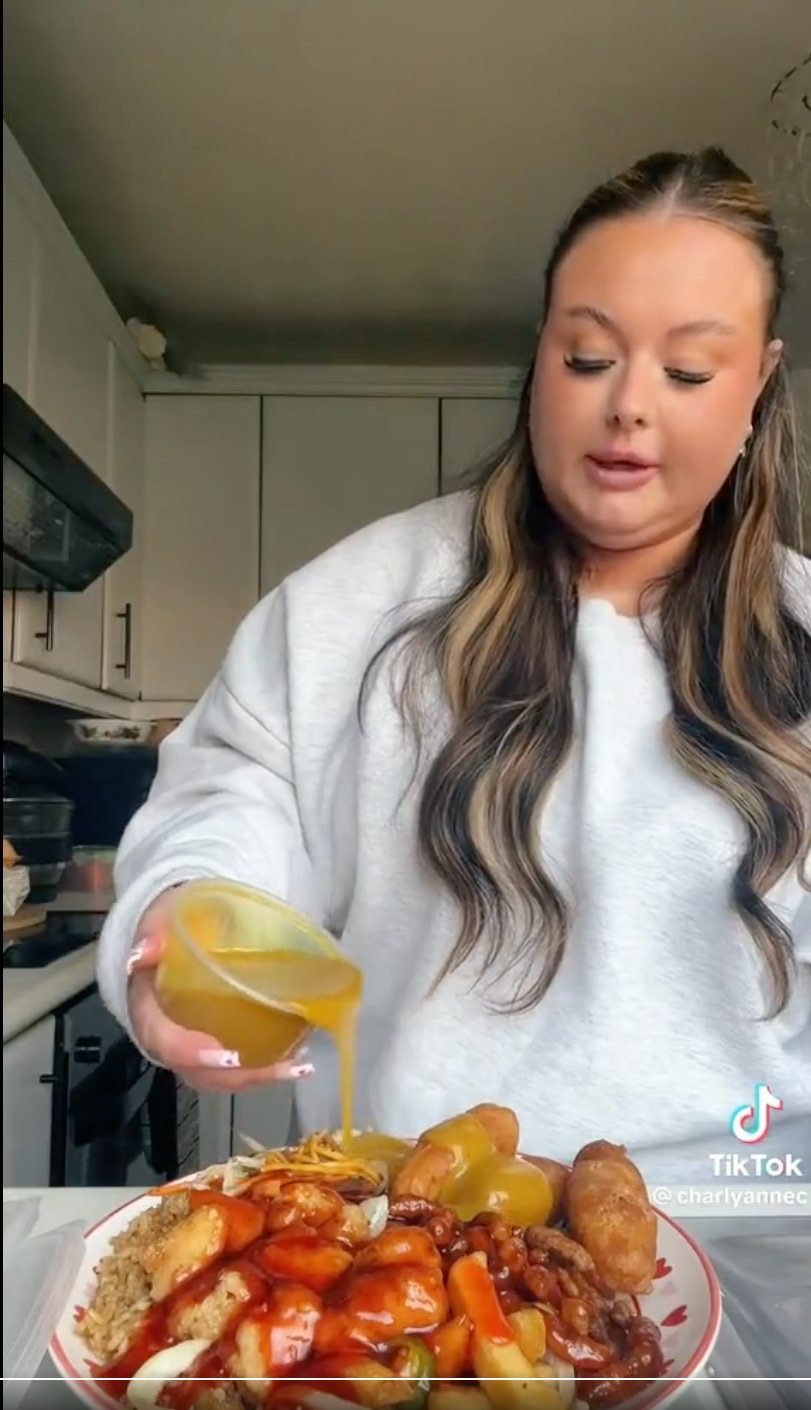 Charly Anne from Britain, demonstrating her Chinese takeaway food on TikTok, and reposted by @KeemVibes with a comment  “So British Chinese food is trending on TikTok. I’ve never been more disgusted in my life. What the F%$# is this???&#xA;&#xA;&#xA;CREDIT: TikTok / @charlyannec