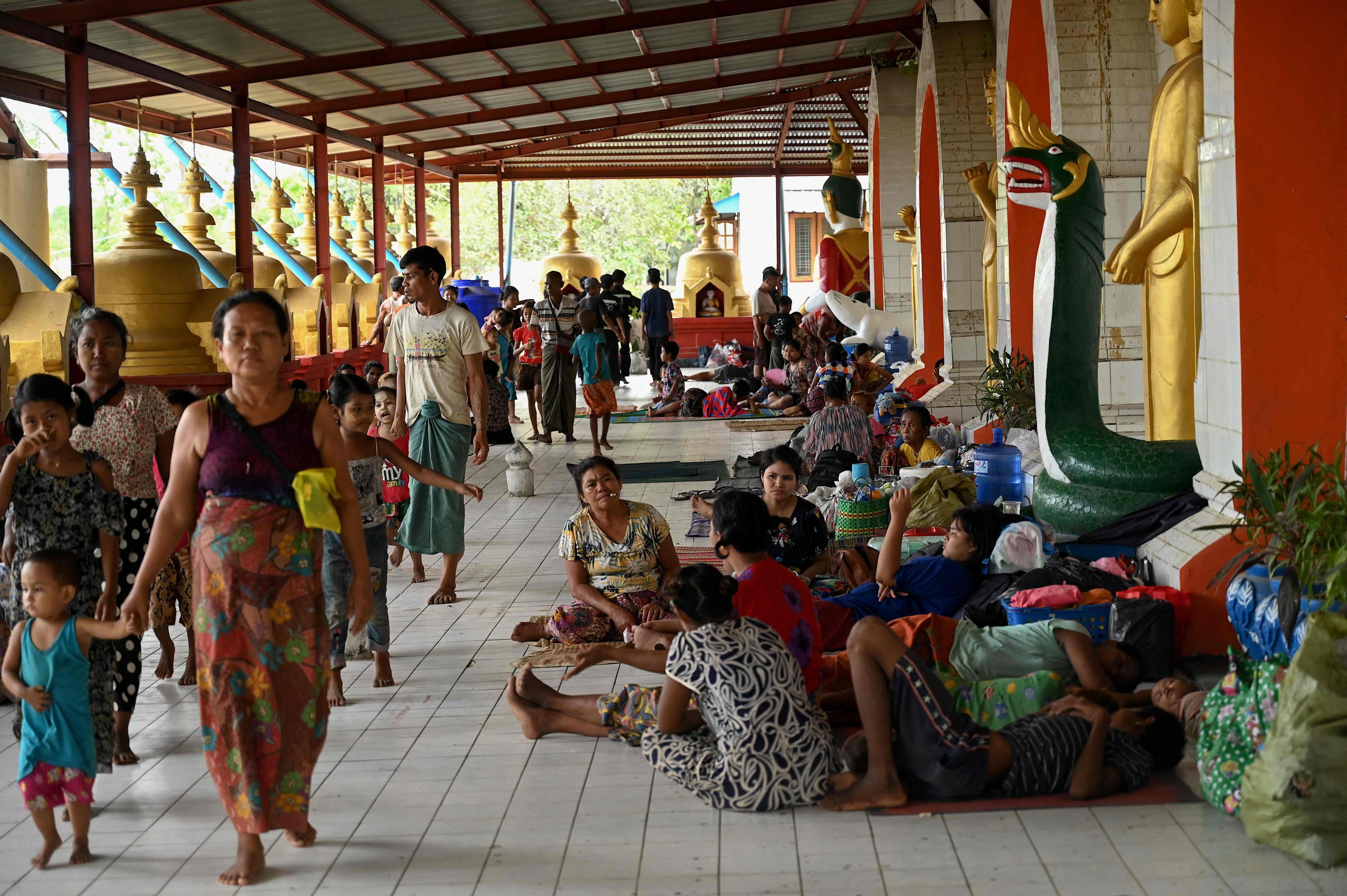 People shelter at a monastery in Sittwe town in Myanmars Rakhine state ahead of the expected landfall of Cyclone Mocha.  Photo: AFP