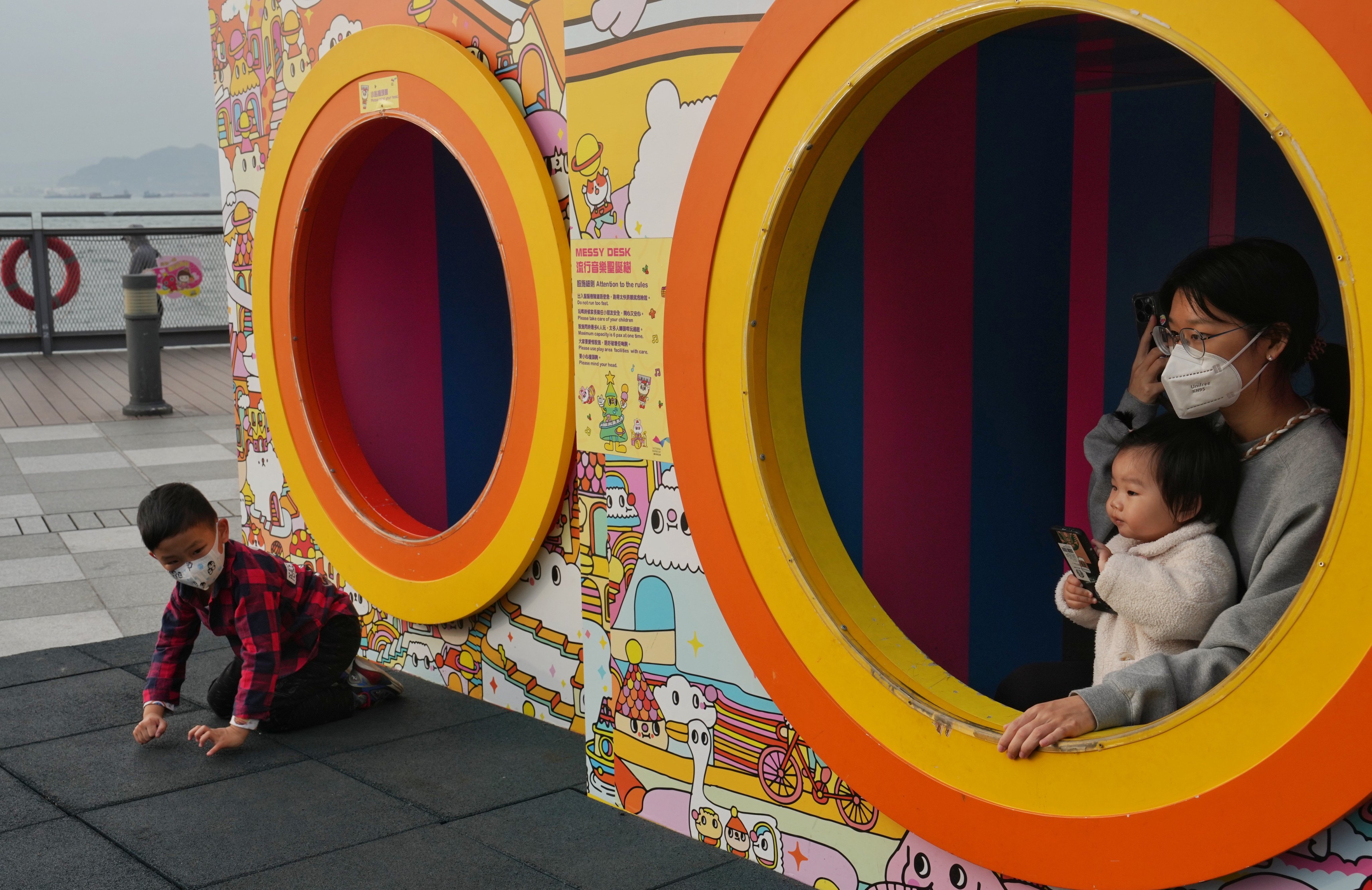 Children play along the Belcher Bay Promenade in Kennedy Town on March 14. Hong Kong’s lack of childcare and family-care options are just some of the hurdles women face in seeking to enter the workforce. Photo: Elson Li