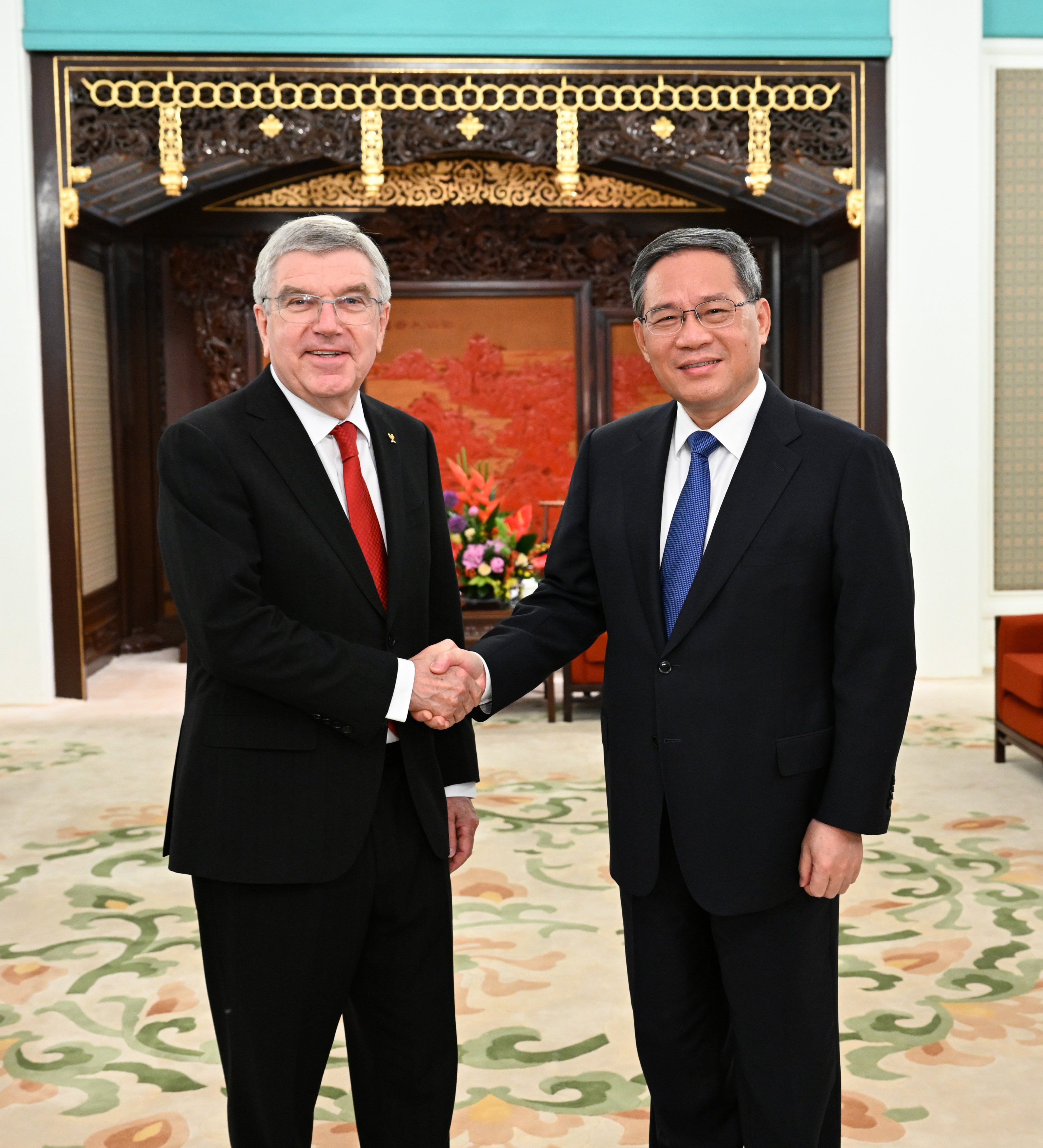 Chinese Premier Li Qiang with International Olympic Committee President Thomas Bach in Beijing this month. Photo: Xinhua