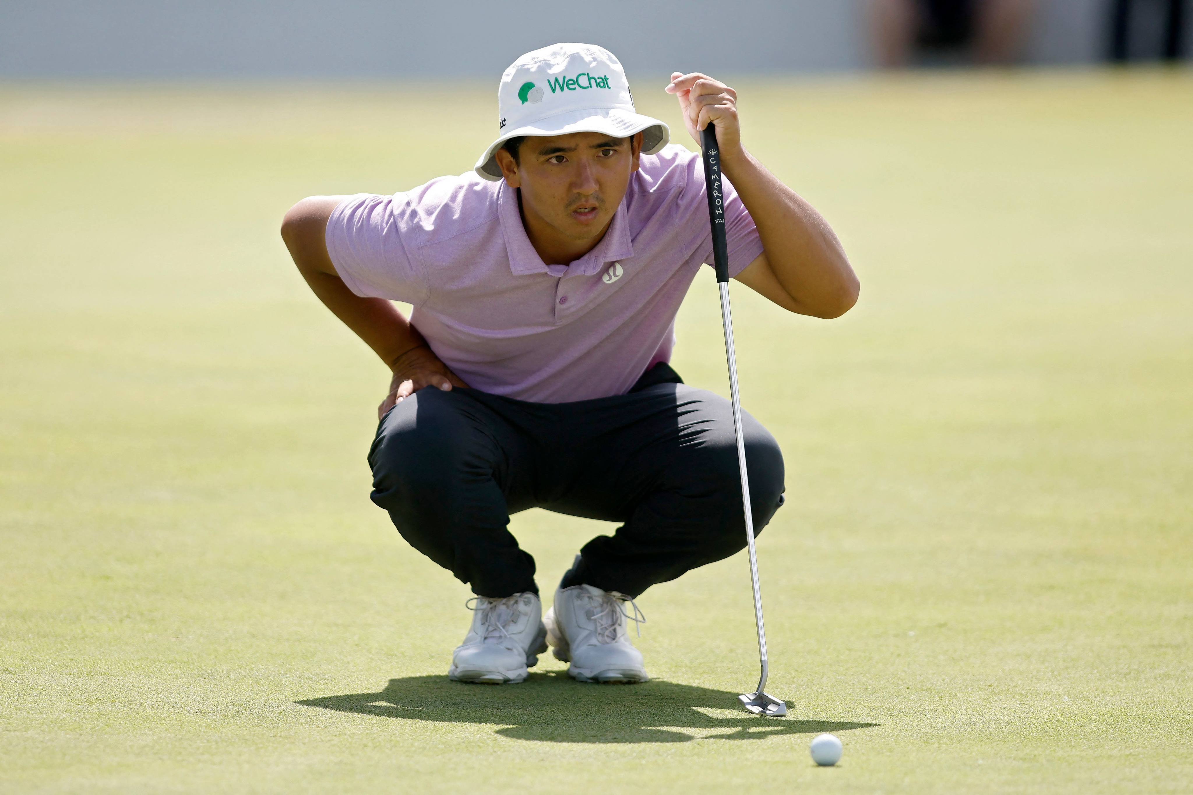 Marty Dou lines up a putt on the 18th green during the third round of the AT&T Byron Nelson. Photo: AFP