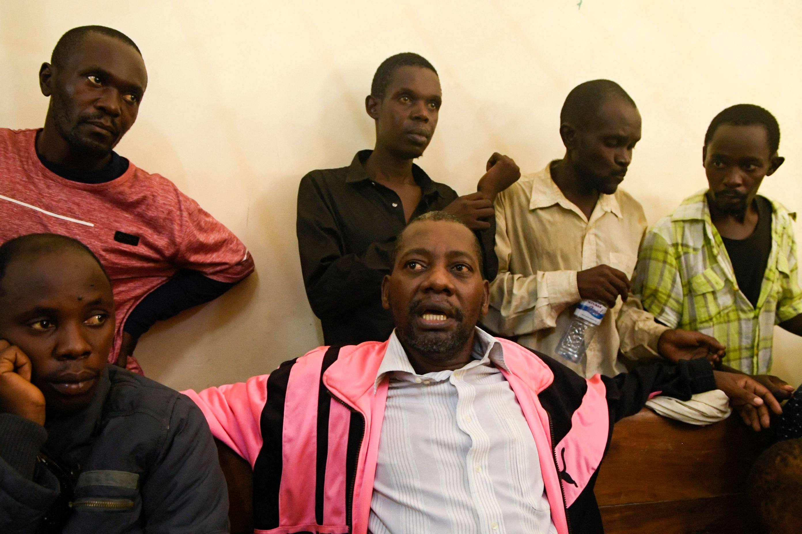 Self-proclaimed pastor Paul Nthenge Mackenzie, wearing.a pink jacket, appears at the Shanzu law courts in Mombasa on May 5. Photo: AFP