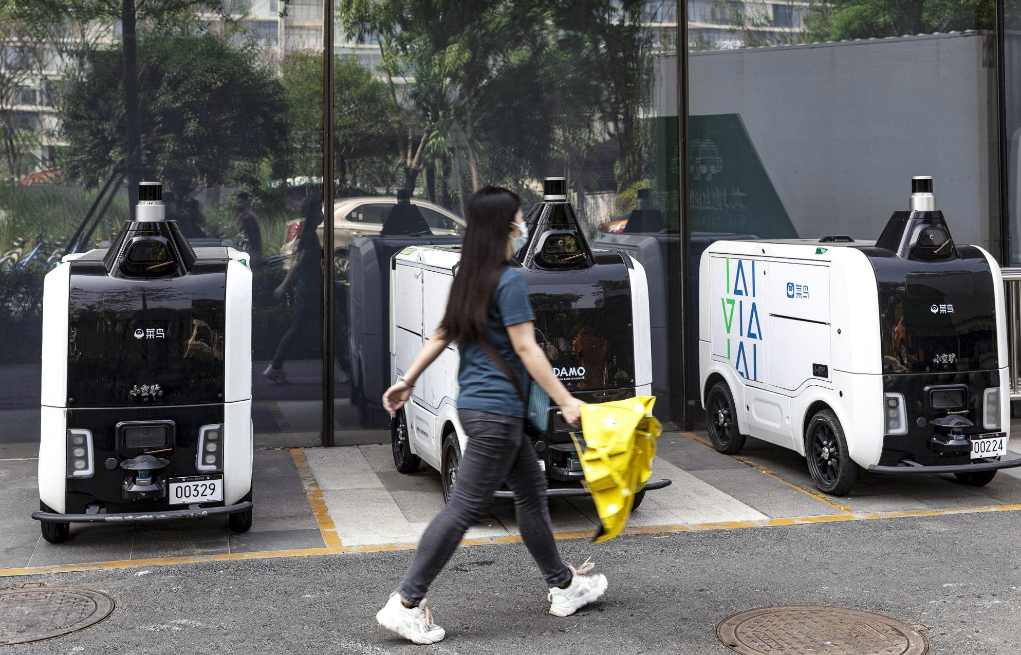 Autonomous delivery vehicles for Cainiao are seen near Alibaba Group Holding's headquarters in Hangzhou, capital of eastern Zhejiang province, on August 2, 2022. Photo: Bloomberg