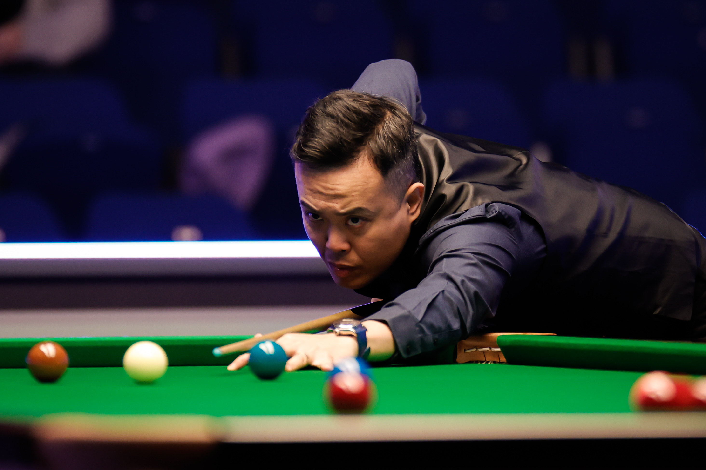 Marco Fu plays a shot in a World Championship qualifier against Martin O’Donnell in Sheffield. Photo: Getty Images