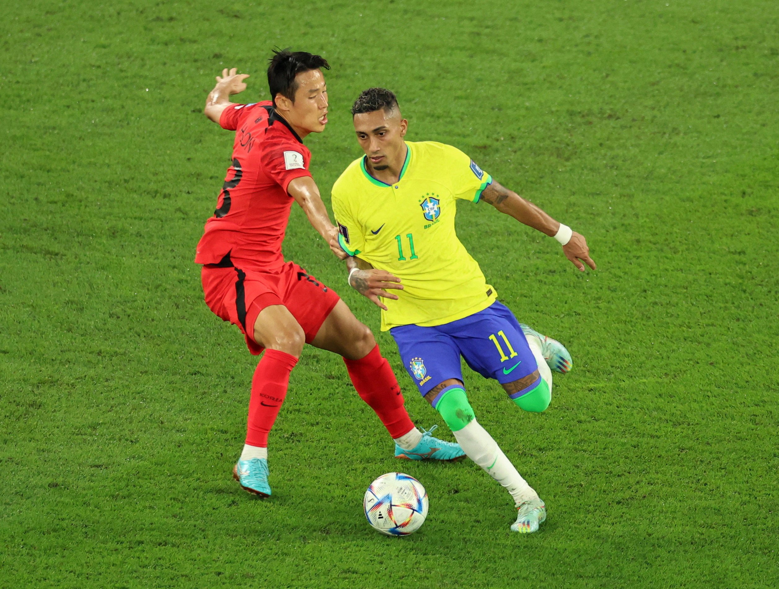 South Korea’s Son Jun-ho attempts to stop Brazil’s Raphinha during their World Cup clash in Qatar last December. Photo: Reuters