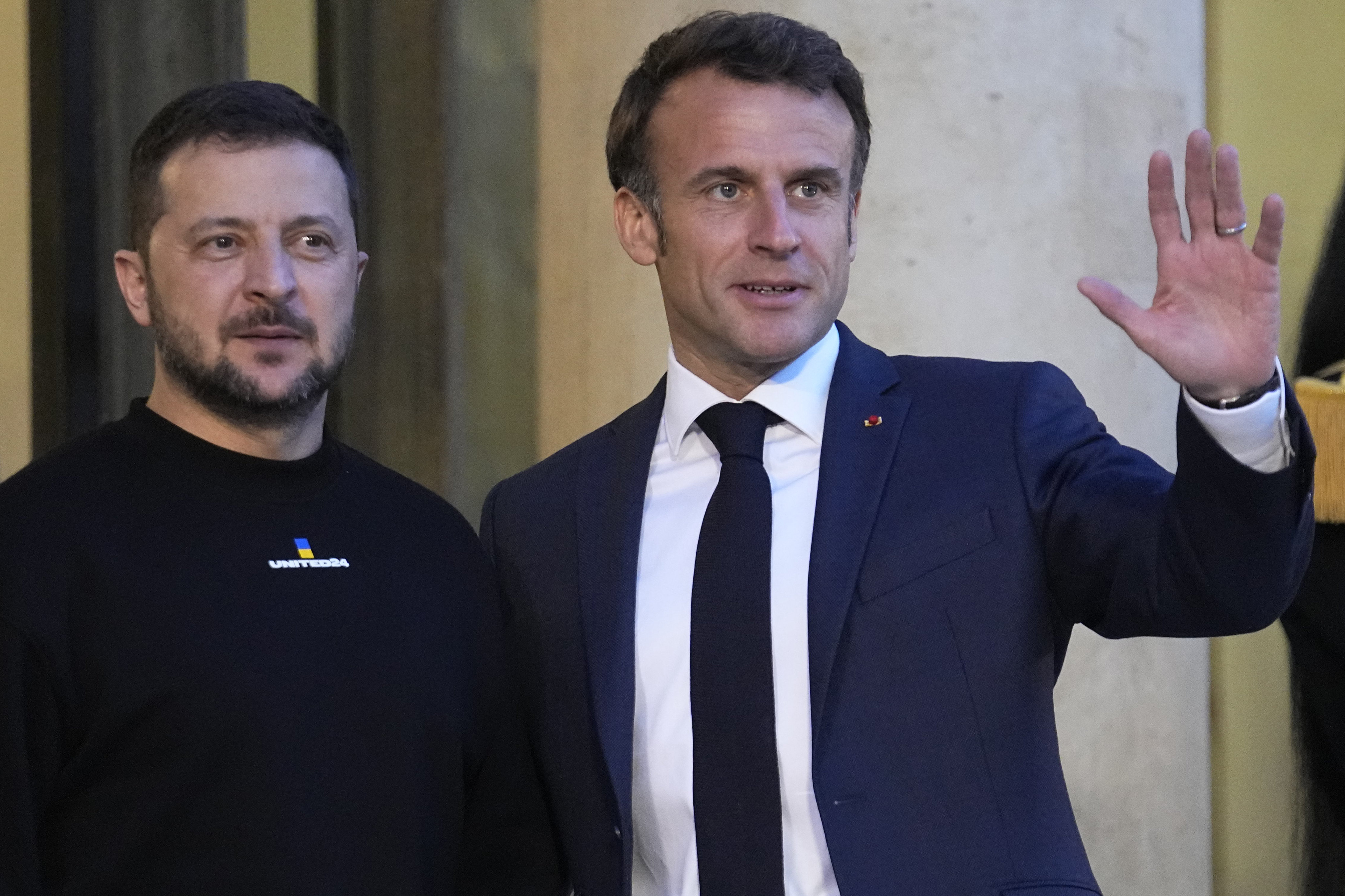 French President Emmanuel Macron (right) welcomes Ukrainian President Volodymyr Zelensky at the Elysee palace in Paris on Sunday. Photo: AP