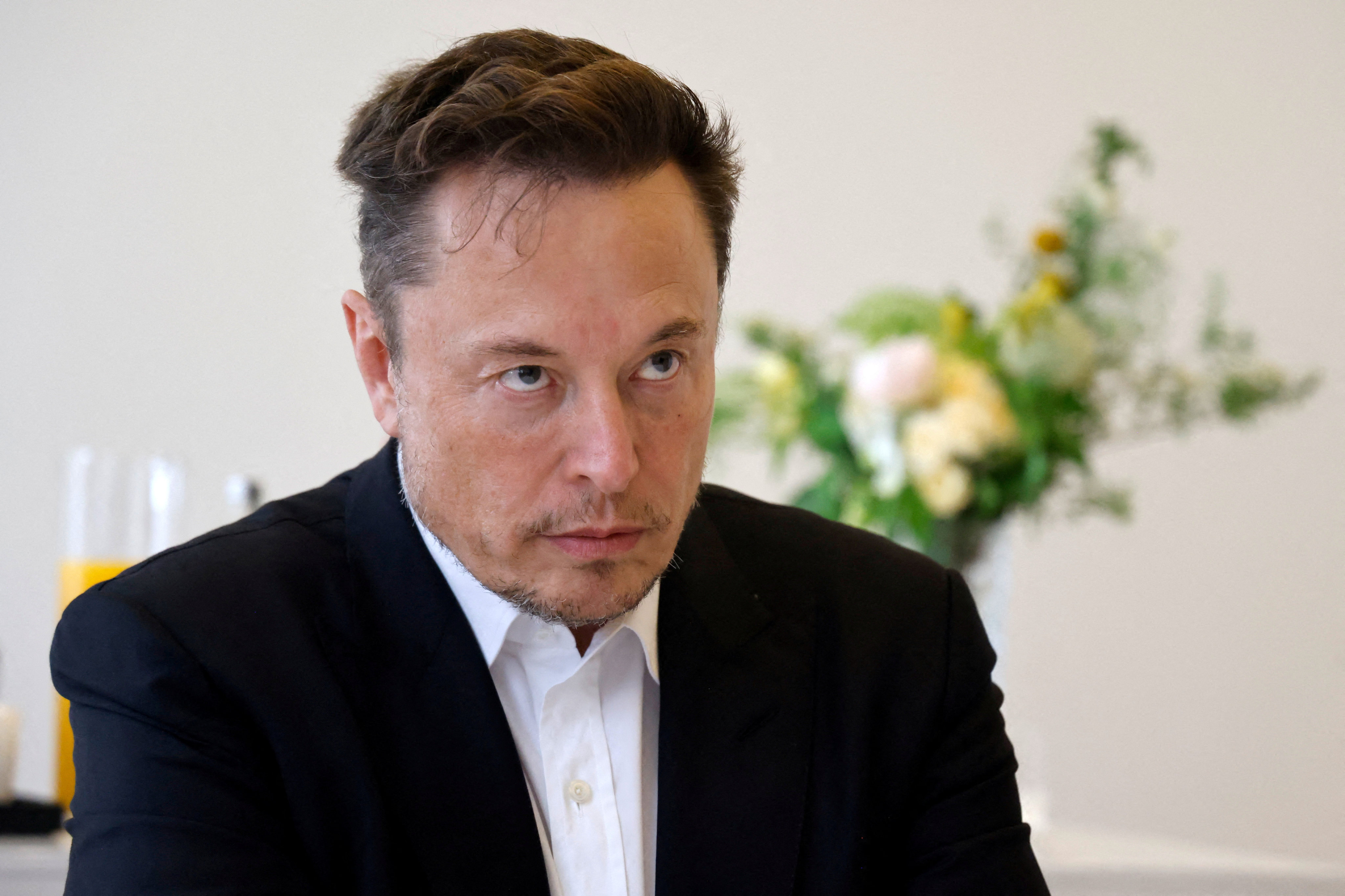 Tesla CEO Elon Musk is seen on the sidelines of the “Choose France” Summit at the Chateau de Versailles, outside Paris, on Monday. Photo: Reuters
