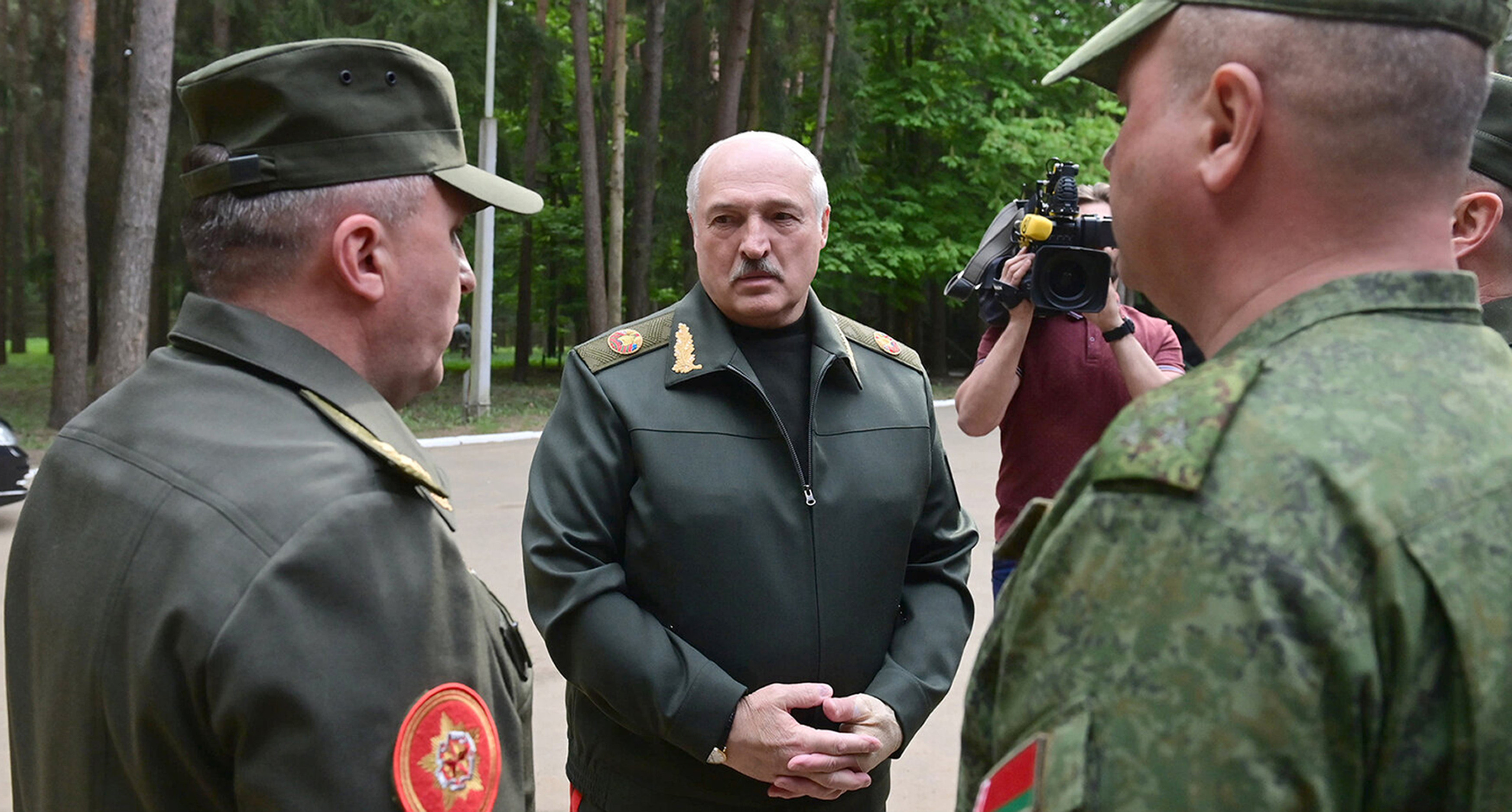 Belarusian President Alexander Lukashenko (centre) speaks to officers as he visits the Central Command Post of the Air Force and Air Defence Forces in Belarus on Monday. Photo: Belarus’ Presidential Press Office via AP