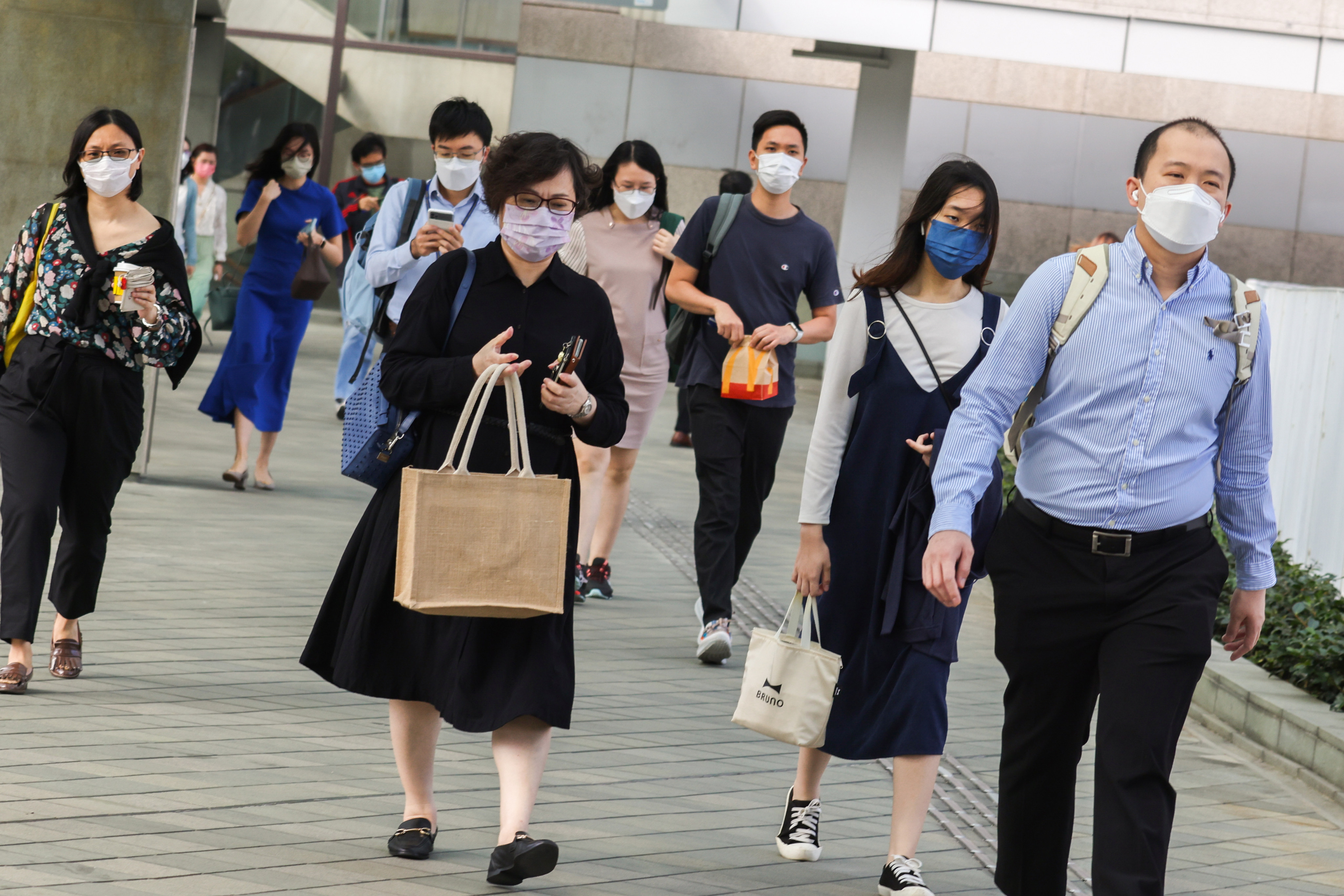 Hong Kong’s civil servants head to work at the government complex in Admiralty. Photo: Nora Tam