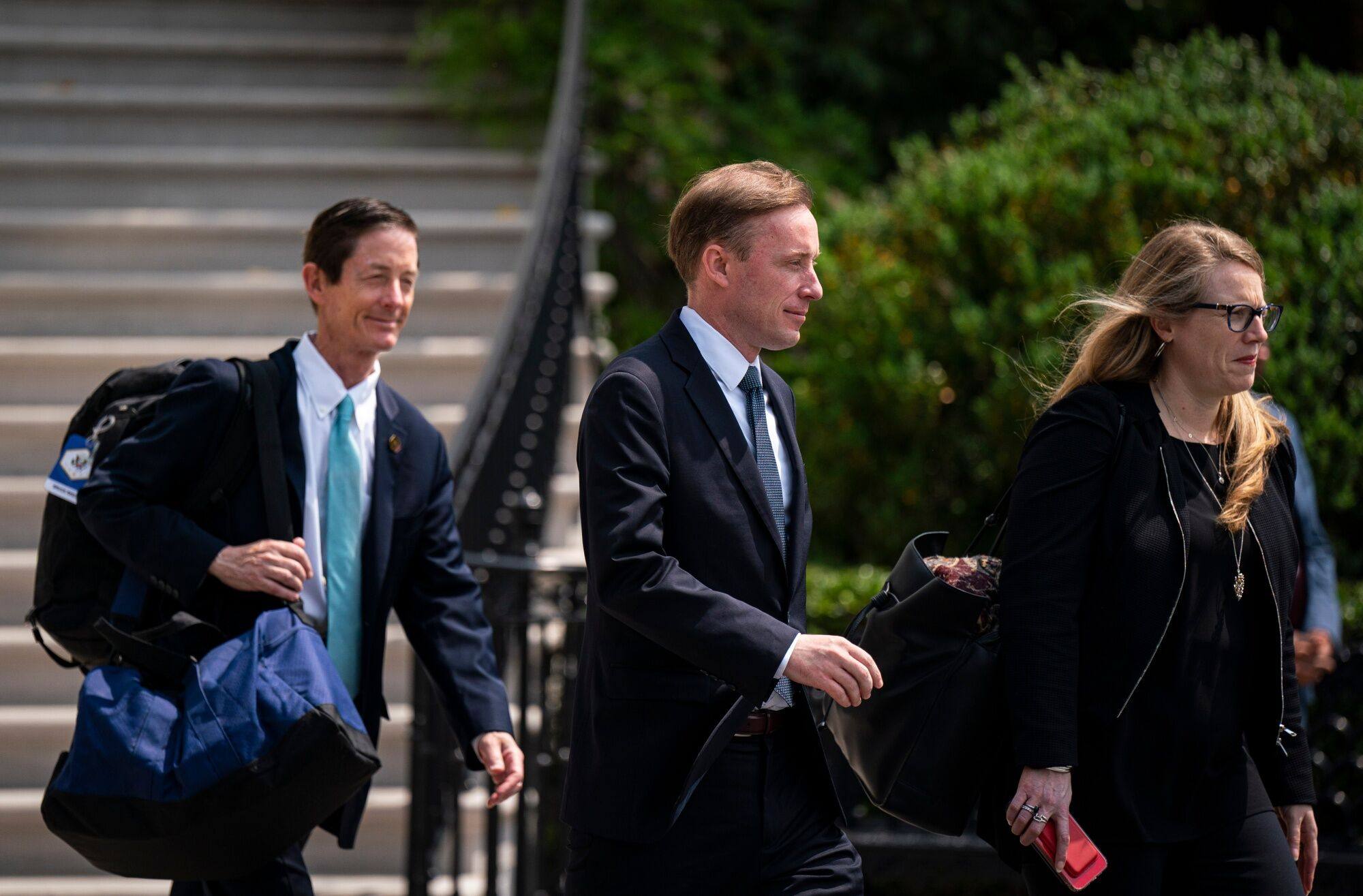 US National Security Adviser Jake Sullivan (centre) walks outside the White House on Wednesday before starting his trip to Japan. Photo: Bloomberg