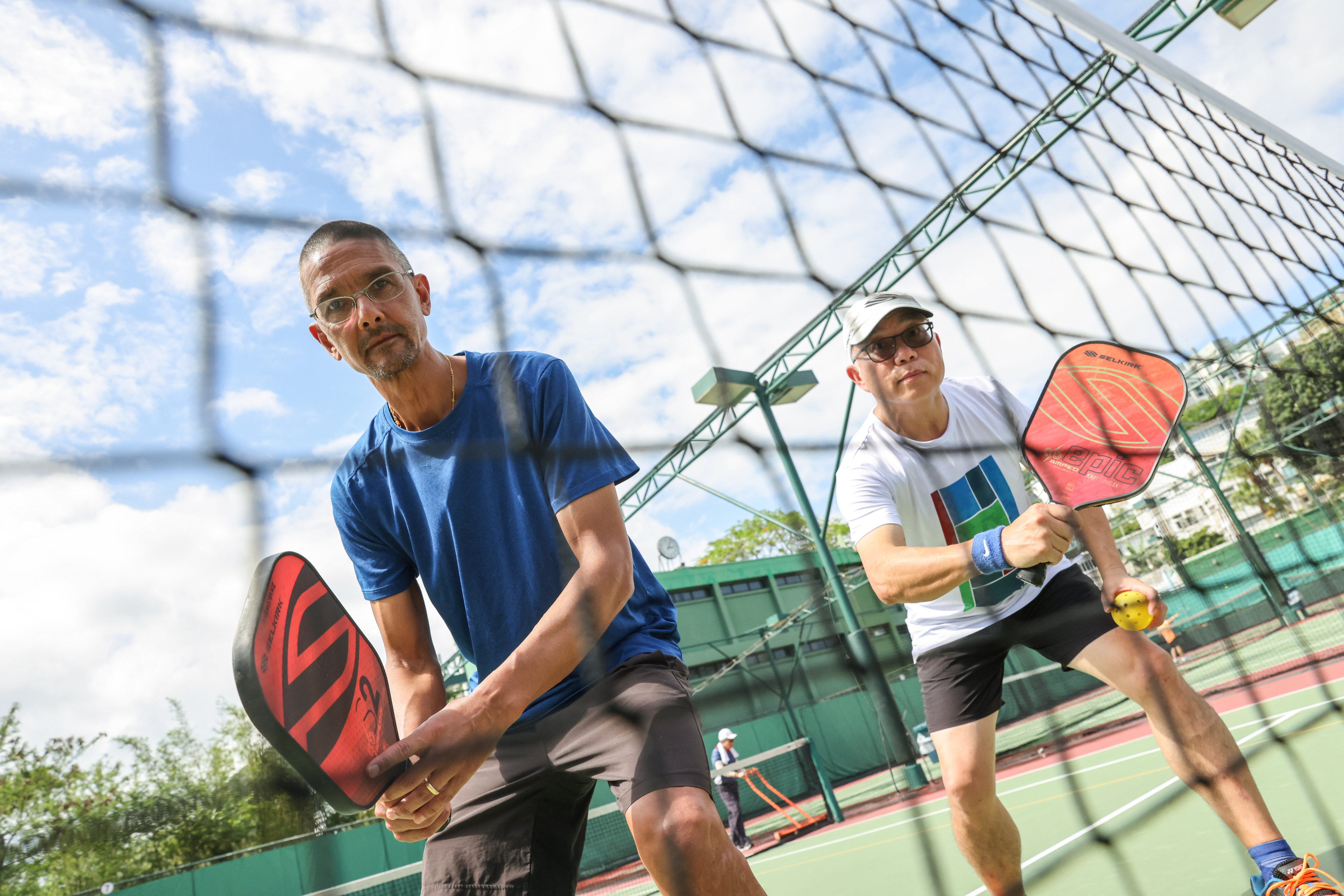 Rajan Khemlyani (left) and David Wong (right) playing pickleball at Hong Kong Country Club in Deep Water Bay. Pickleball is the fastest growing sport in North America and it has arrived in Hong Kong. Photo: May Tse