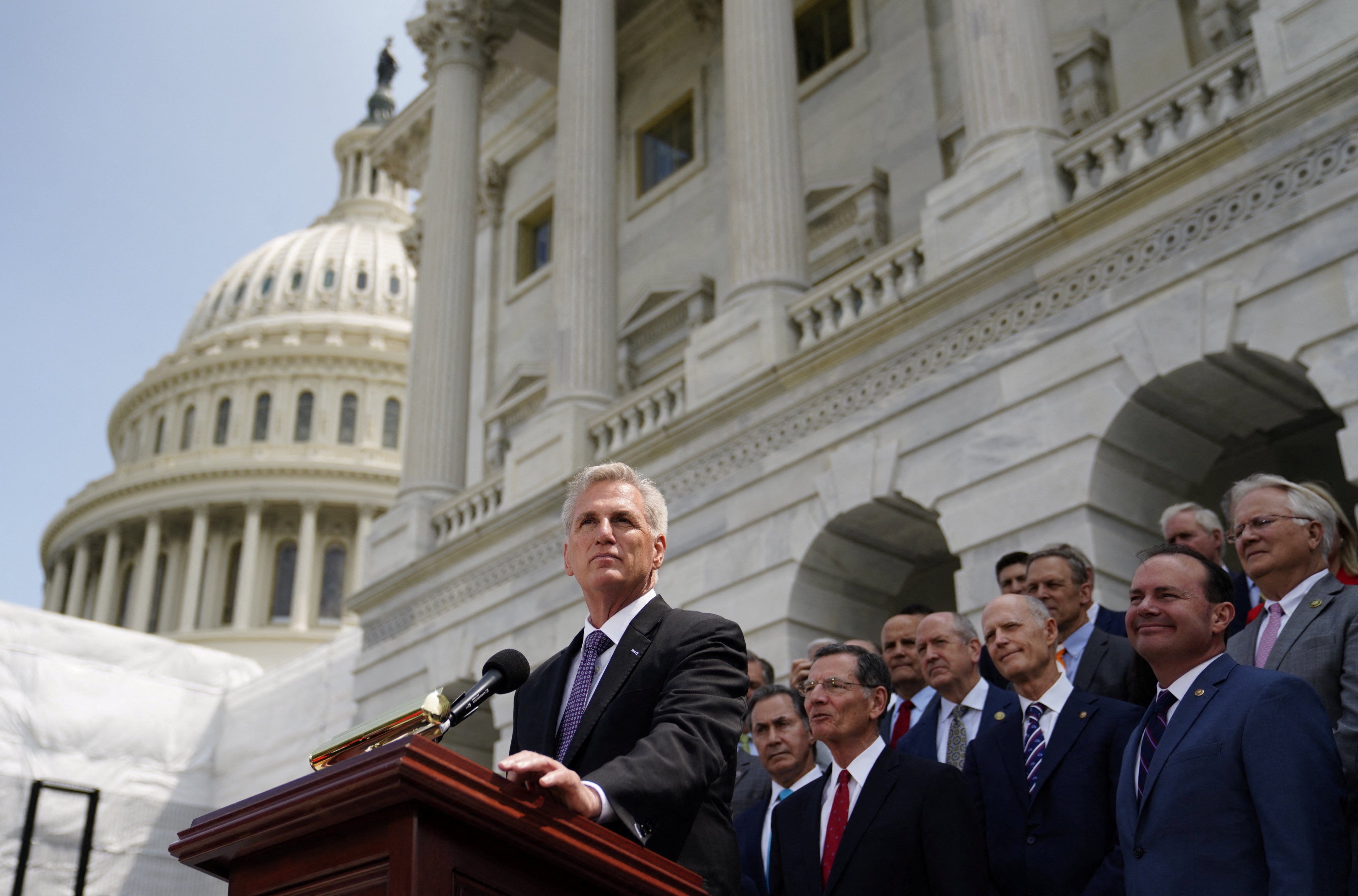 US Speaker of the House Kevin McCarthy (right) stands with Congressional Republicans during an event addressing debt ceiling negotiations with President Joe Biden outside the US Capitol in Washington on May 17. Photo: Reuters